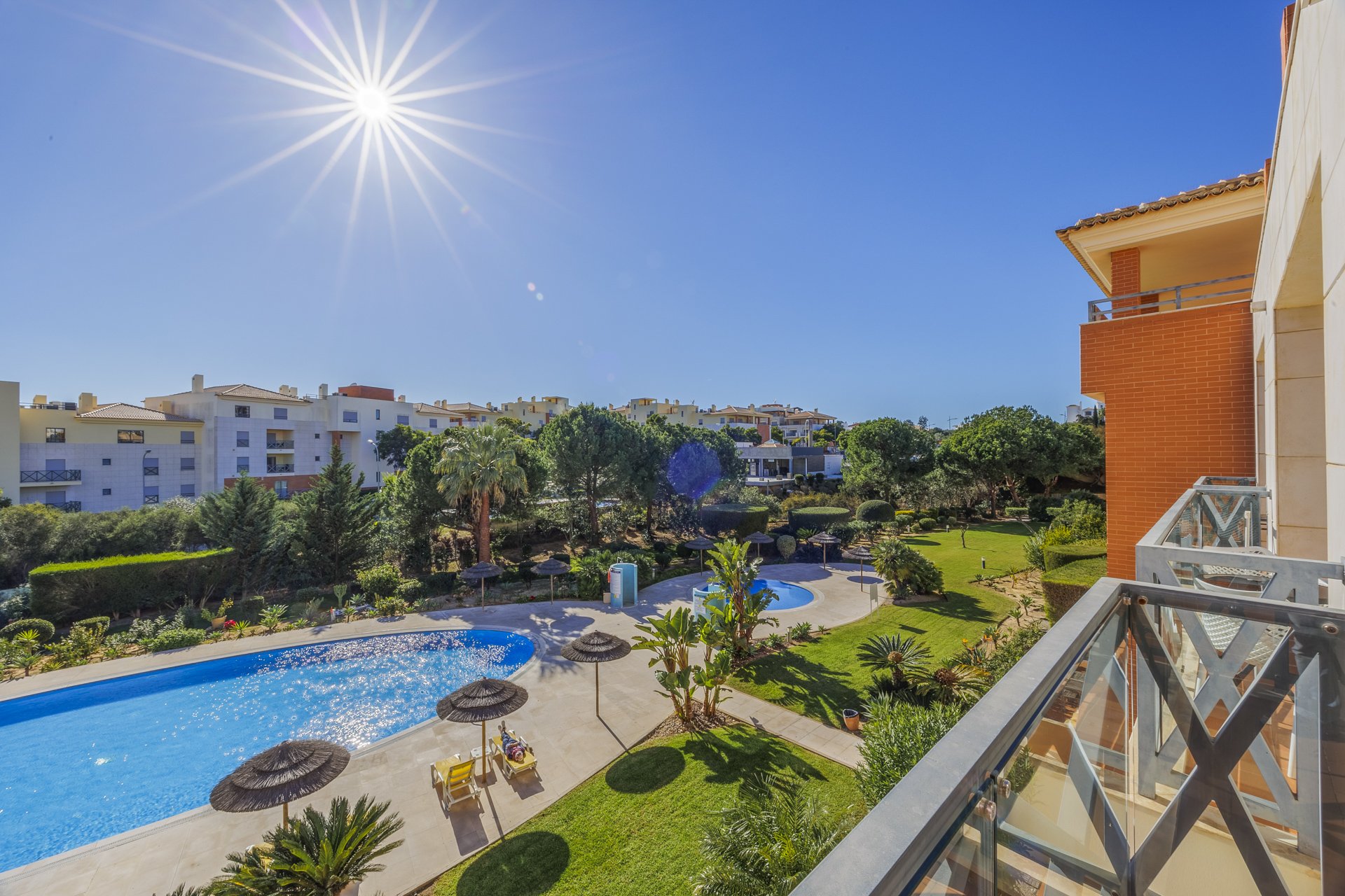 The communal pool, sun loungers and gardens from above