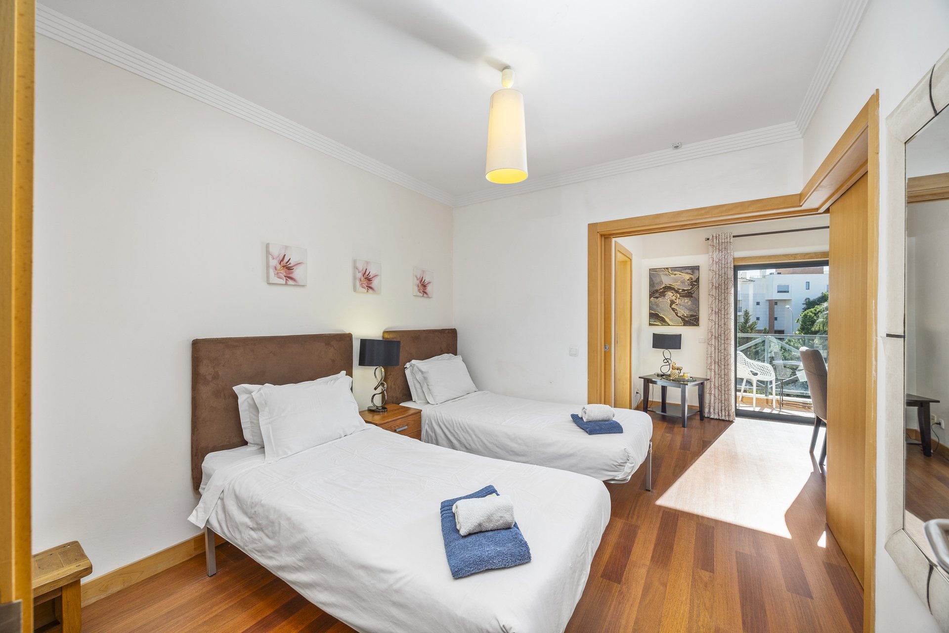 Twin bedroom with balcony access
