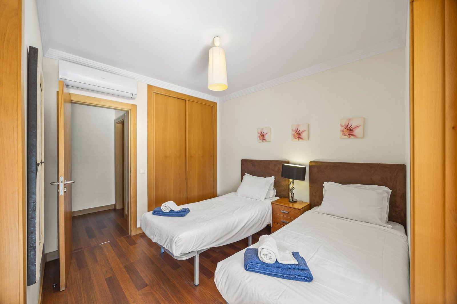 Twin bedroom with brown suede headboards