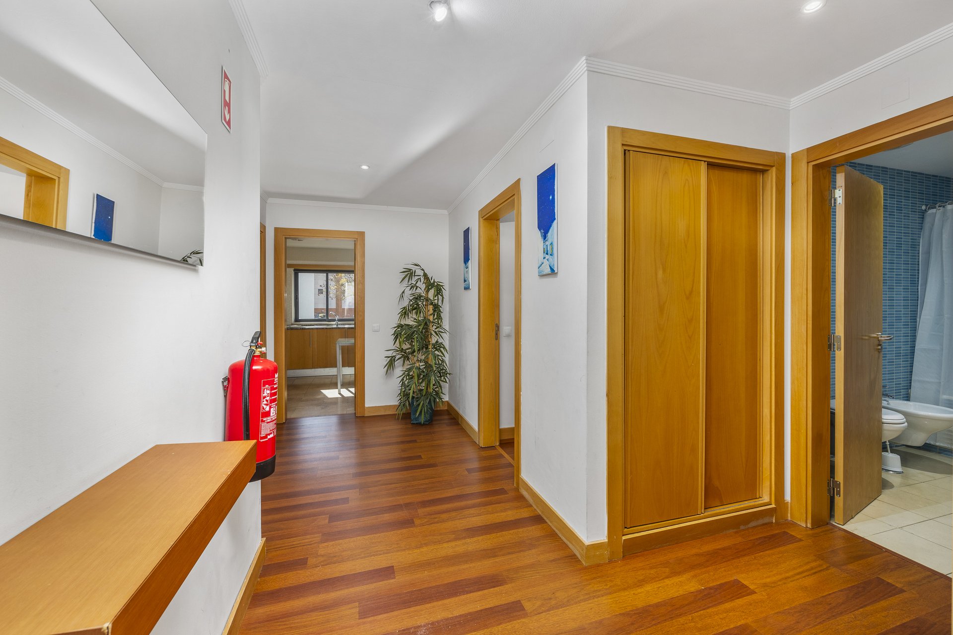 Hallway with access to bedrooms and bathroom