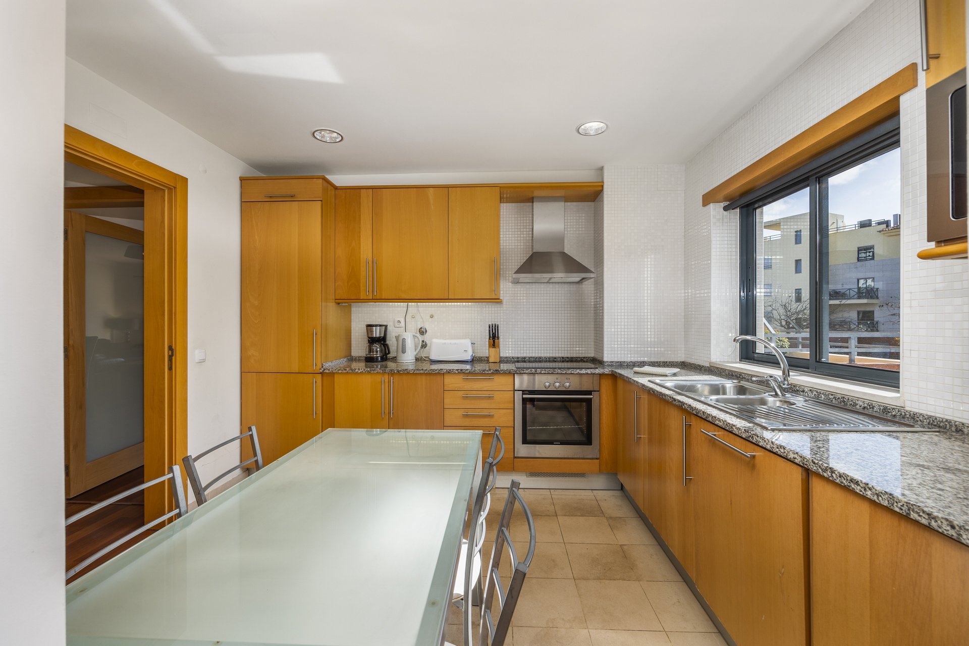 Kitchen with gas hob, oven, and sink