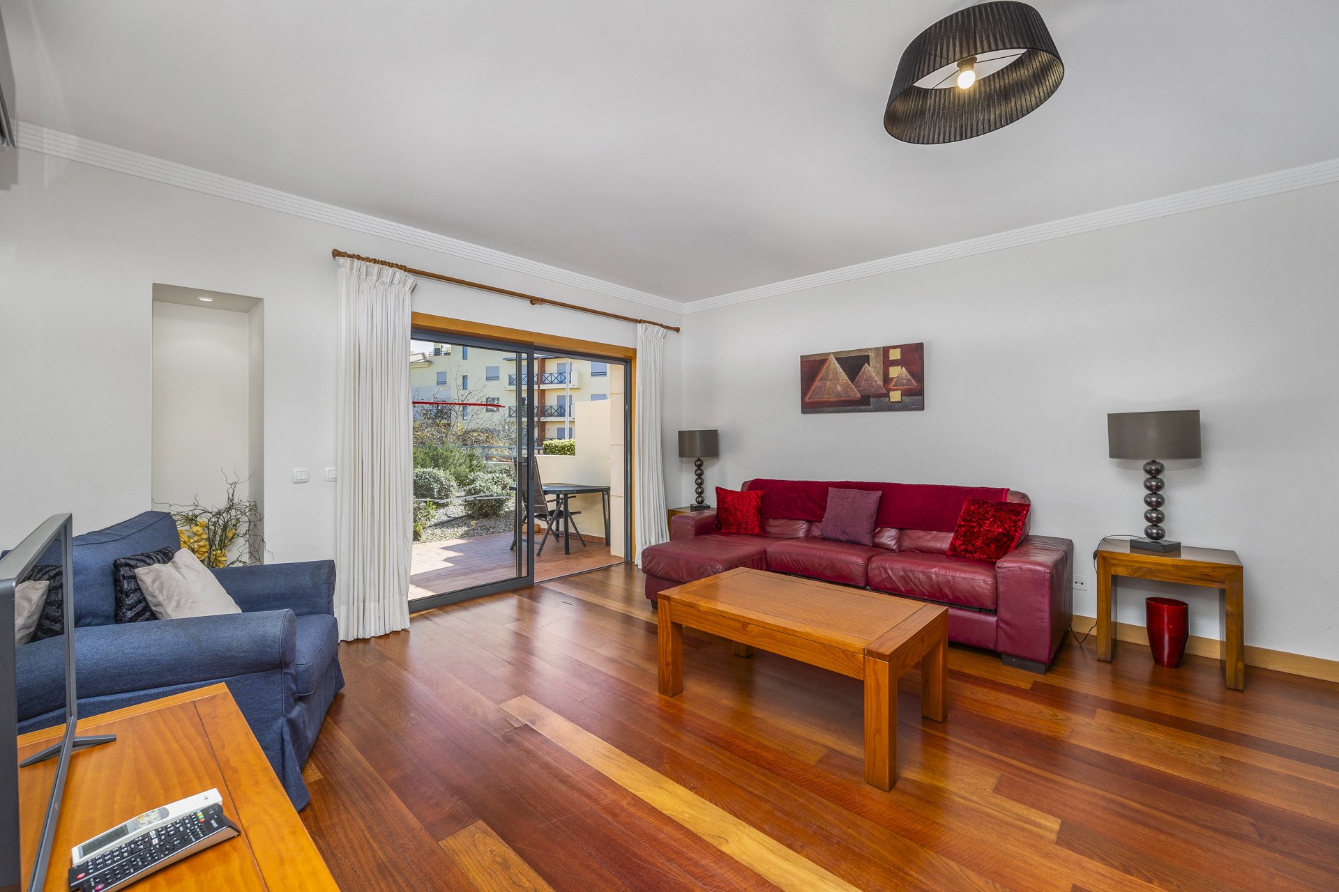Living and dining area with mirror and sideboard