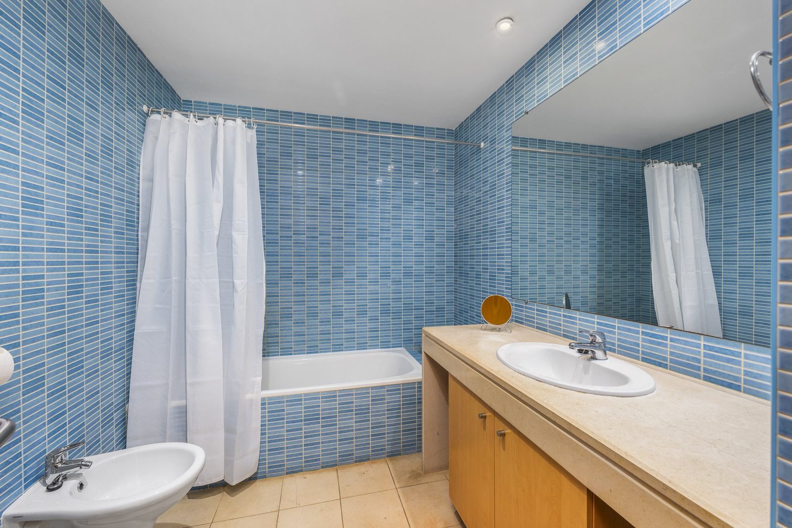 Second bathroom with bathtub, sink, and bidet
