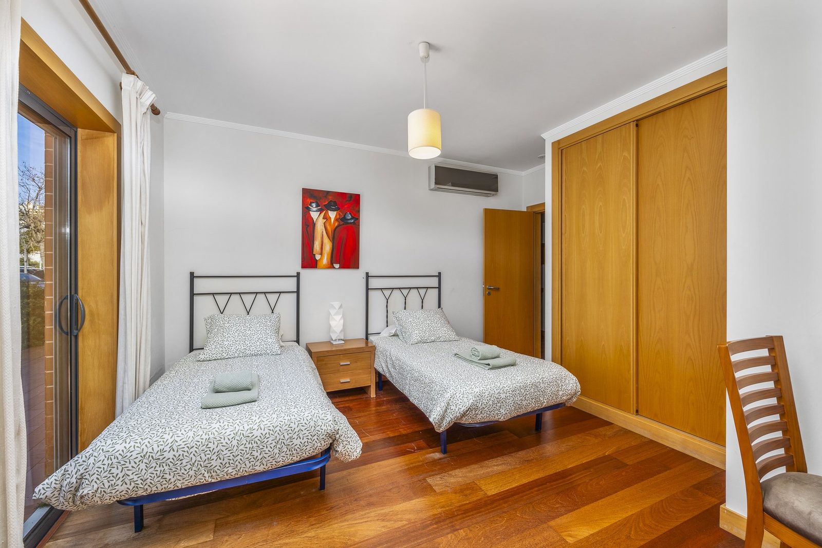 Twin bedroom with wardrobe storage