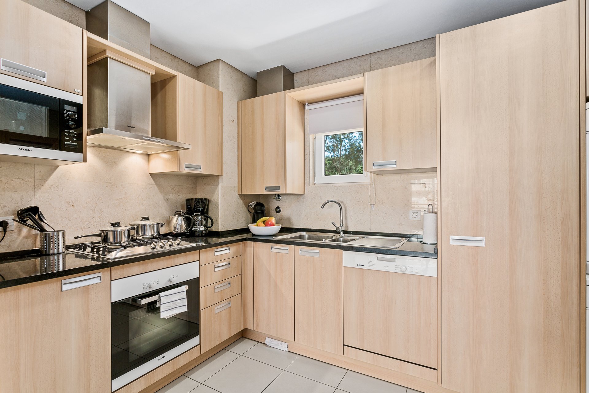 Kitchen with sink and dining pass-through