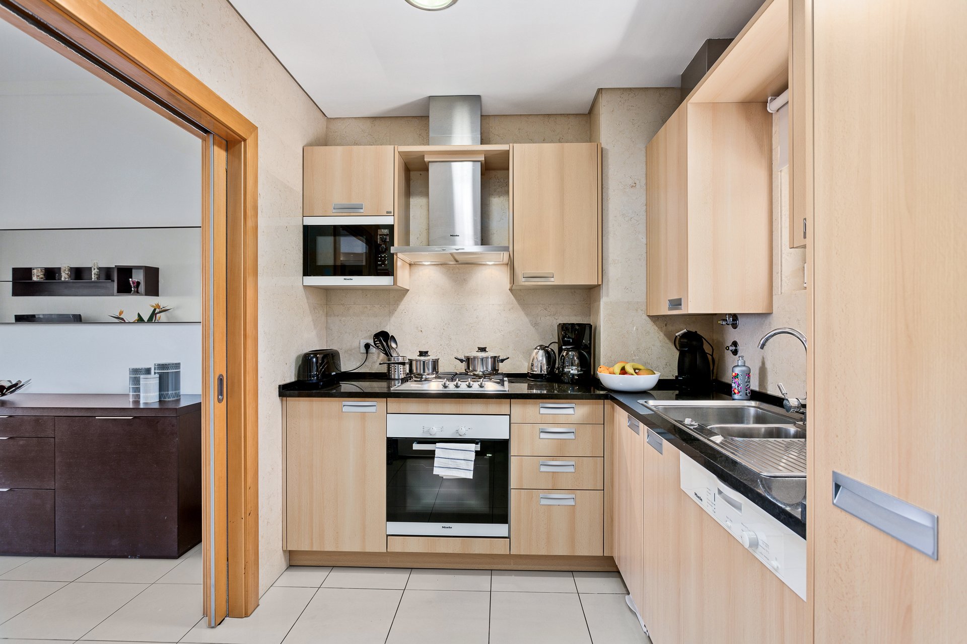 Kitchen with oven, hob, and dishwasher