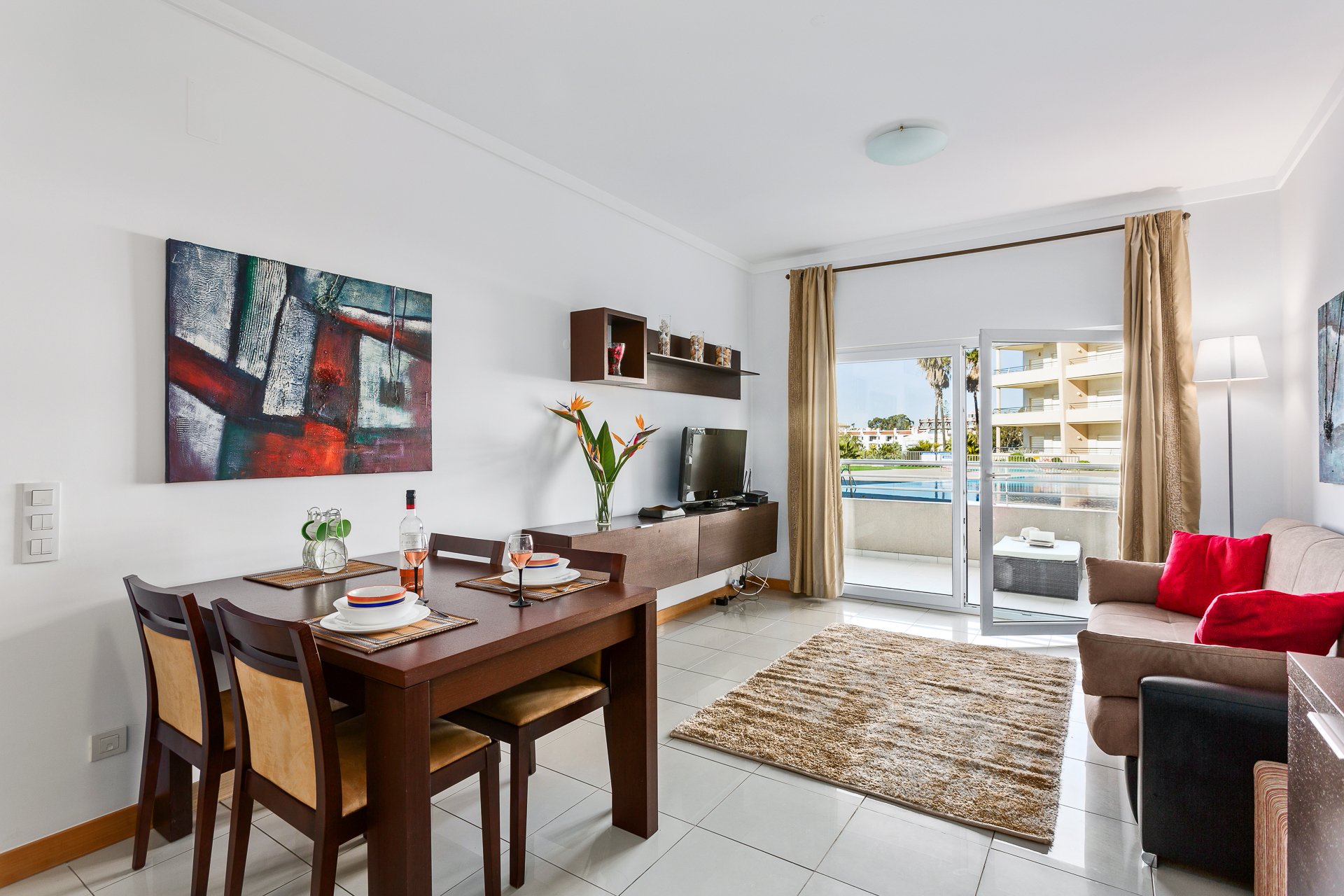 Living and dining area with balcony access