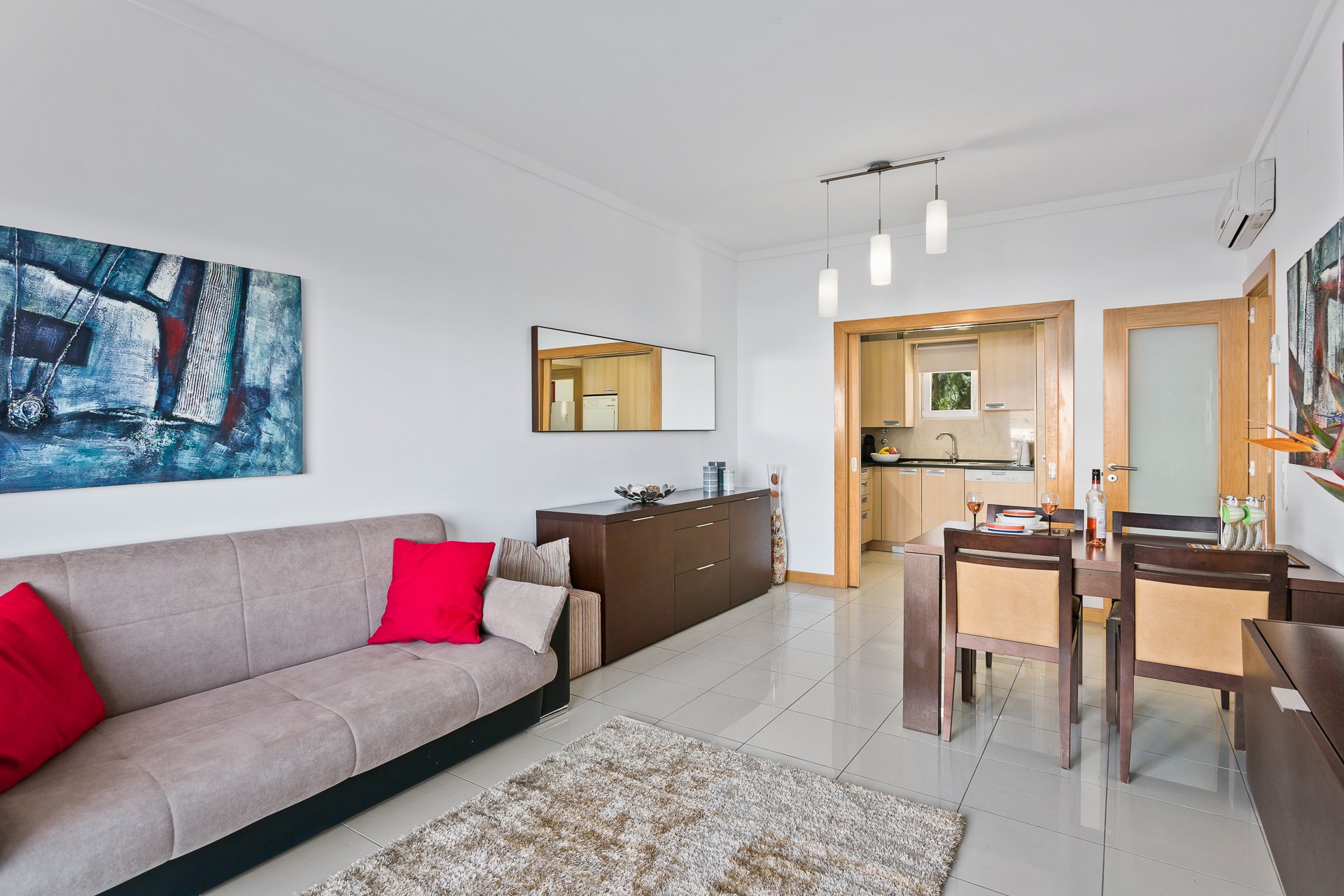 Living room with dining table and kitchen view