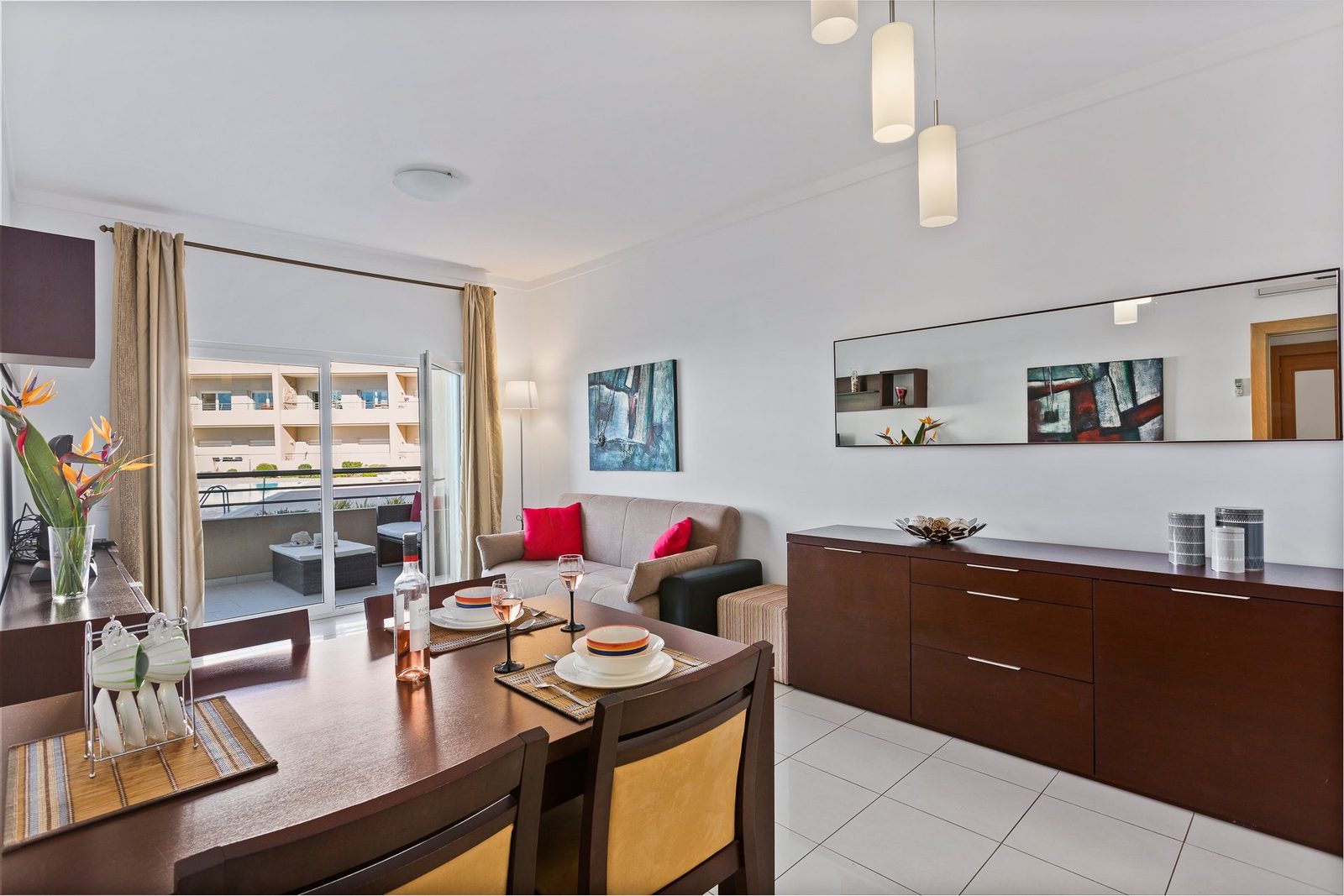 Dining area with mirror and sideboard