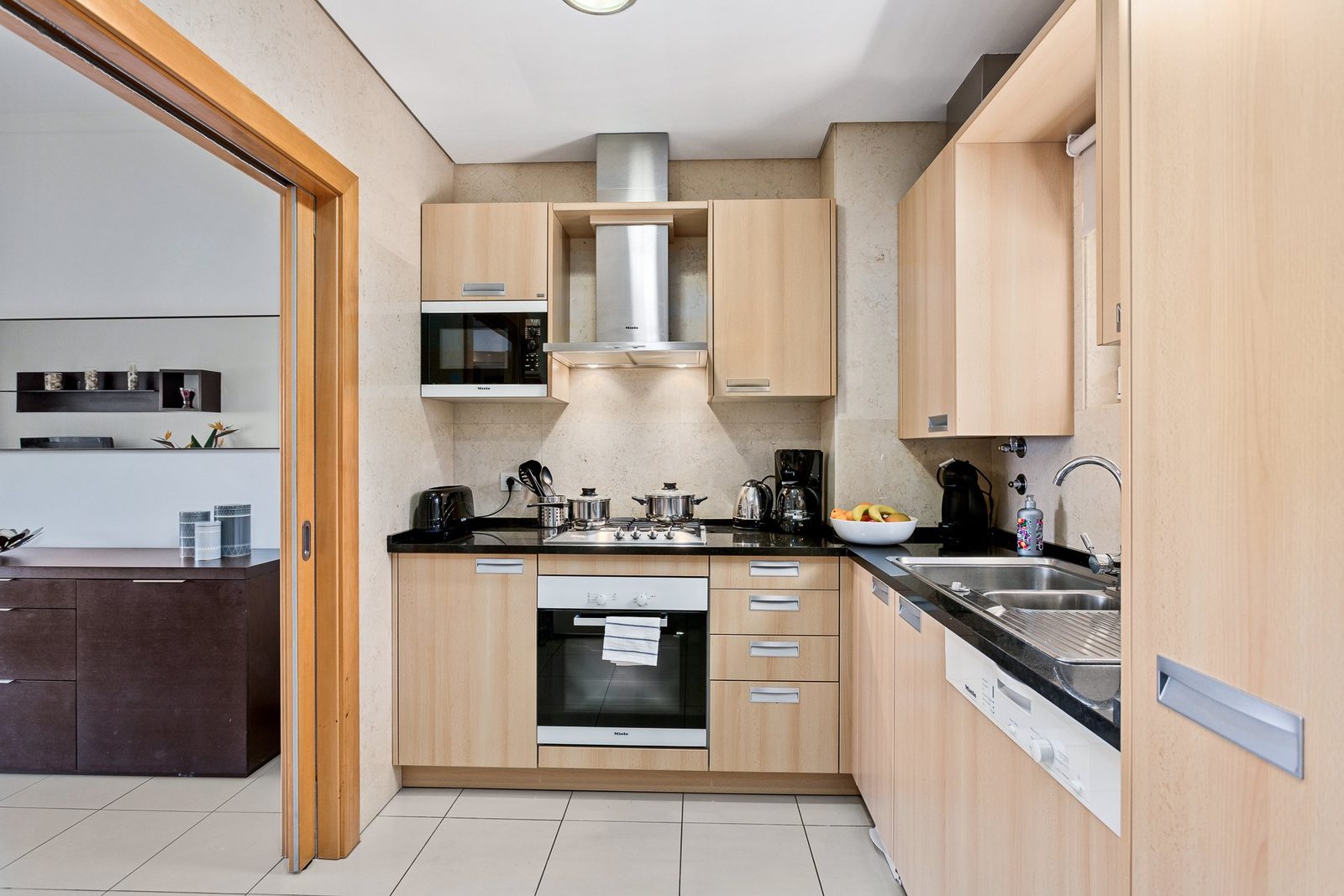 Kitchen with oven, hob, and dishwasher