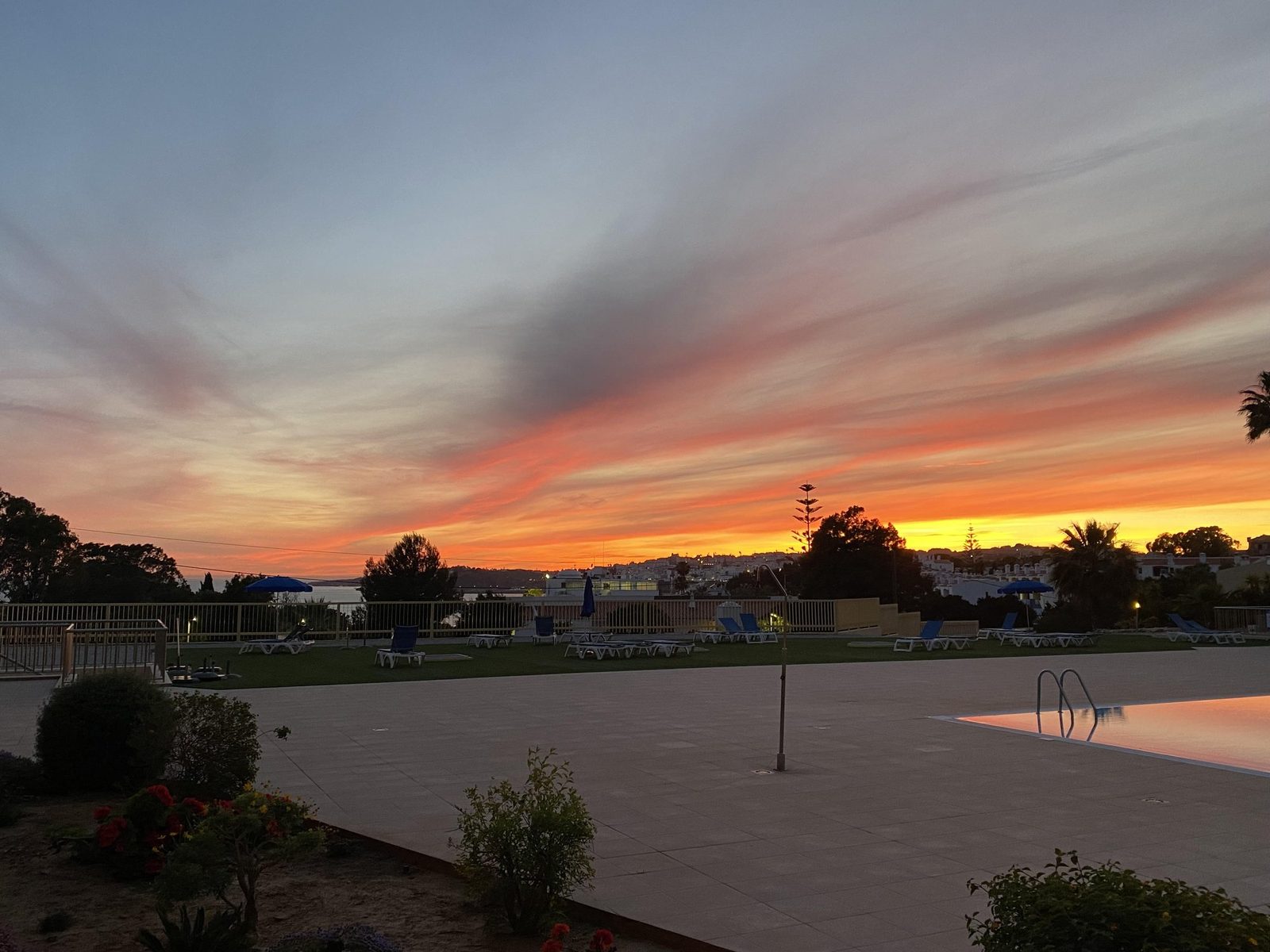 Sunset view over the pool and coastline