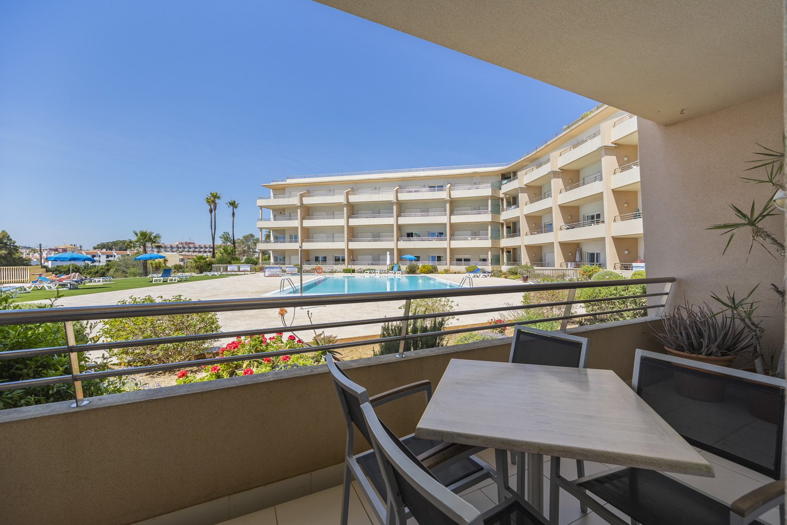 Balcony view over the pool and gardens