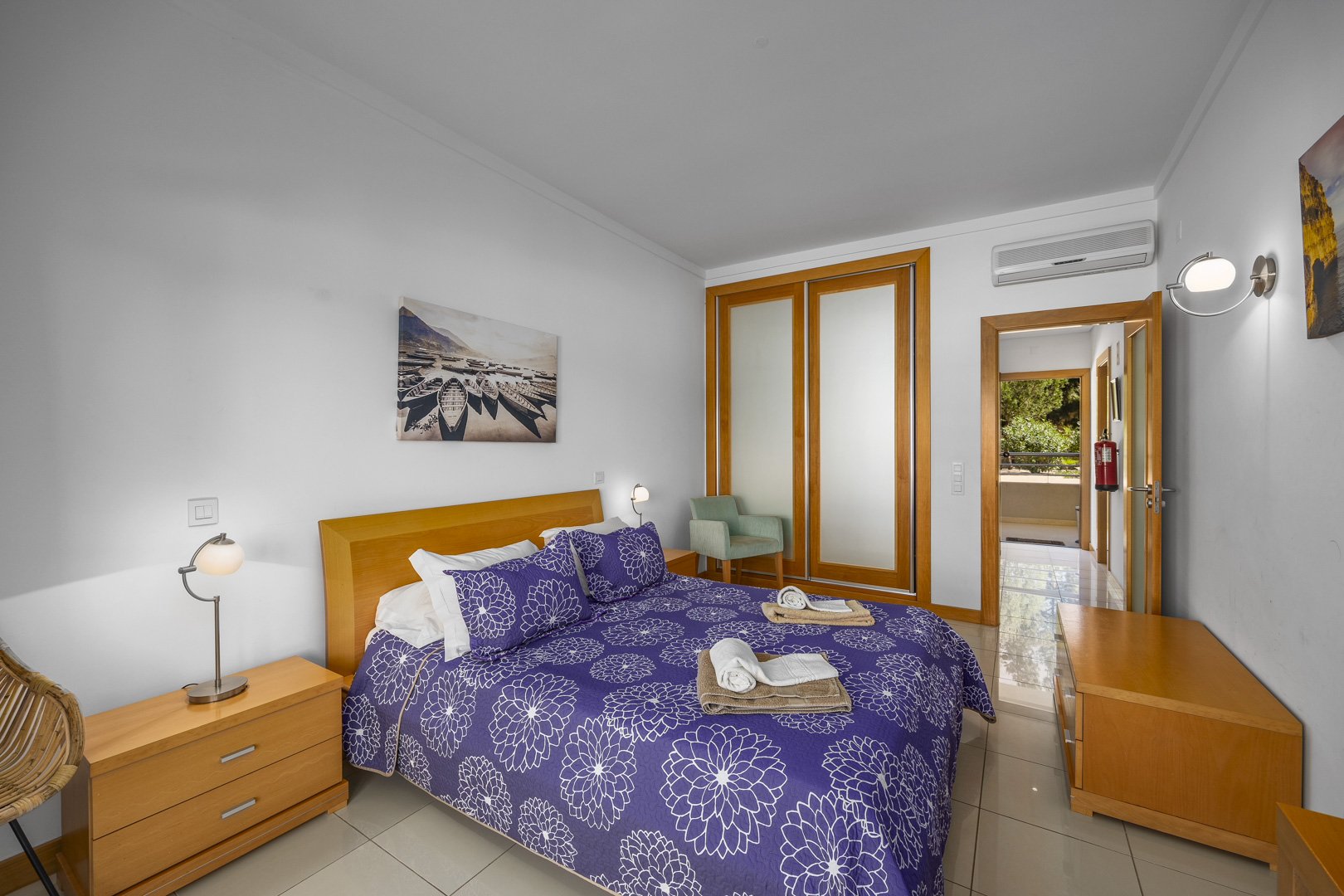 Bedroom with wardrobe and door to hallway