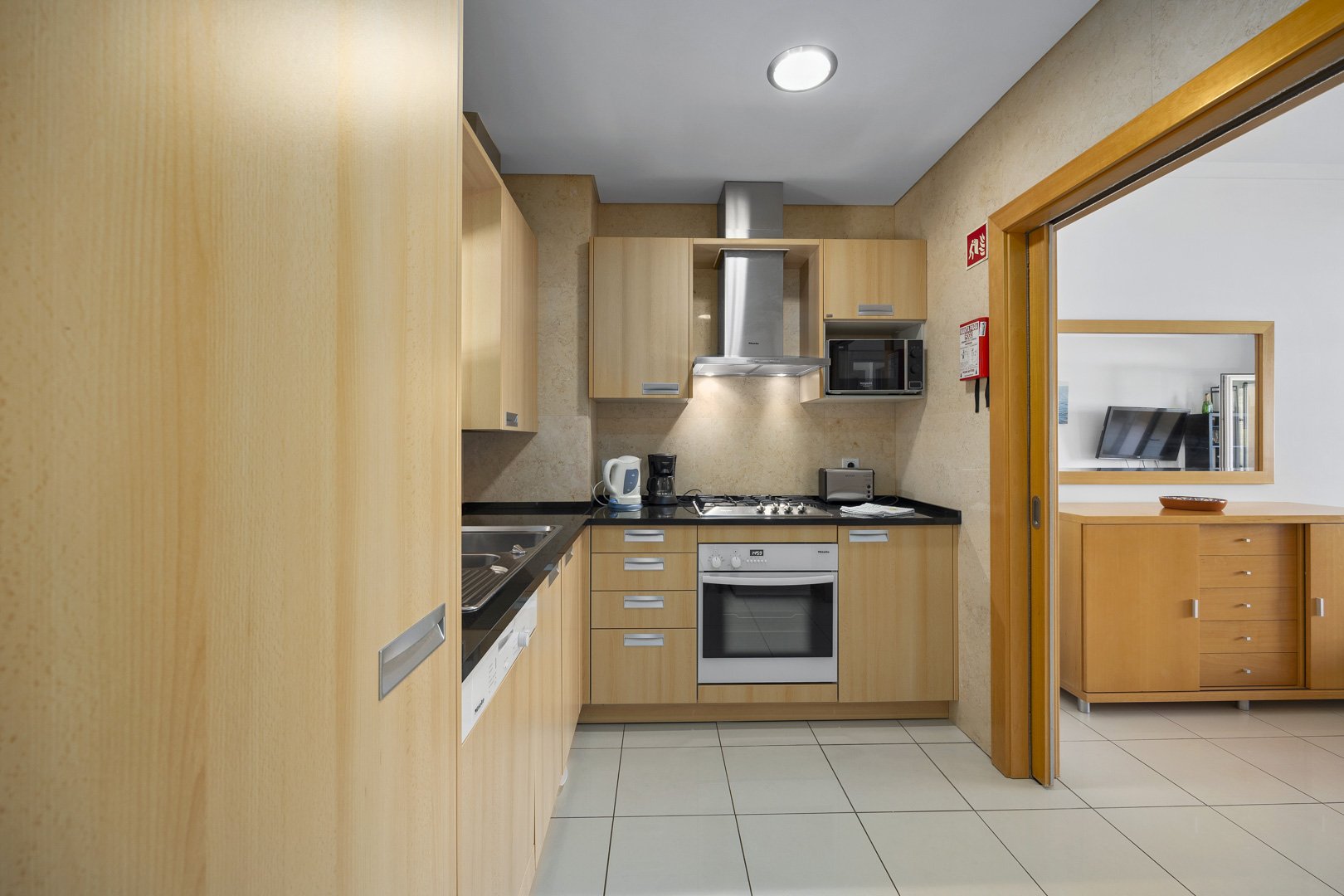 Kitchen with pass-through view into the living room
