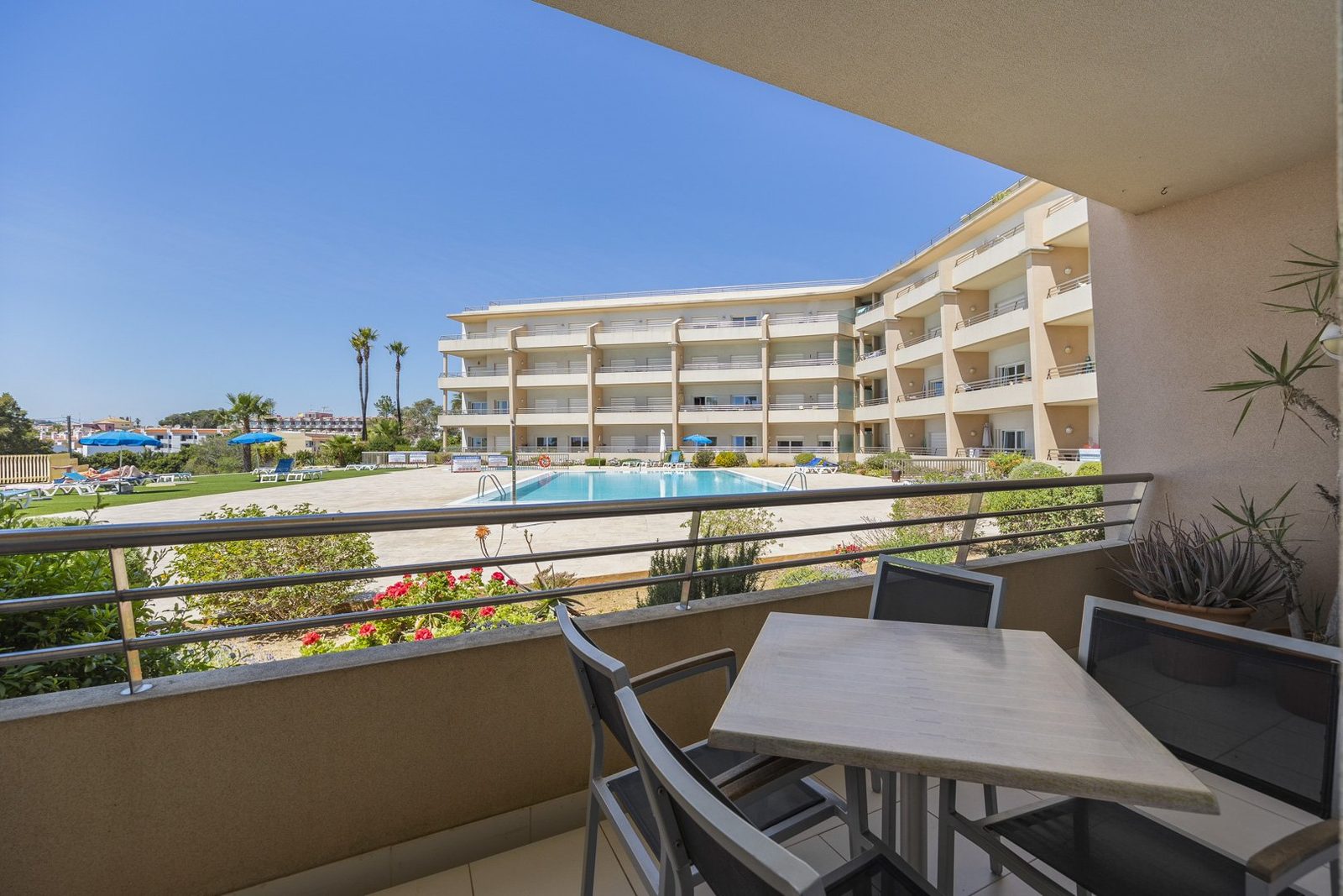 Balcony view over the pool and gardens