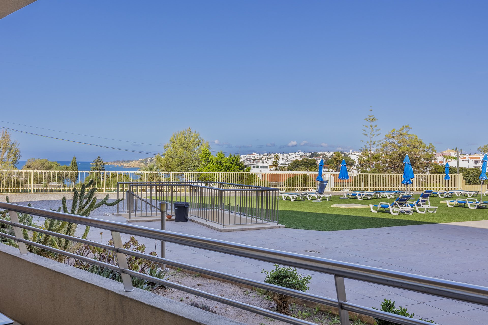 Balcony with wide coastal and grounds view