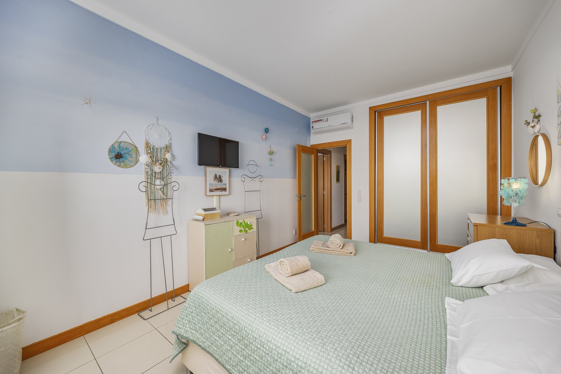 Bedroom with wardrobe and door to the hallway