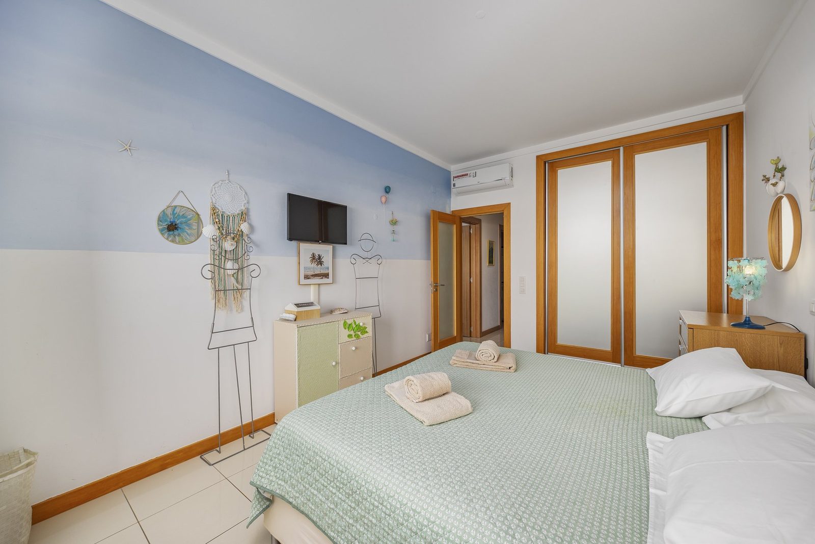 Bedroom with wardrobe and door to the hallway