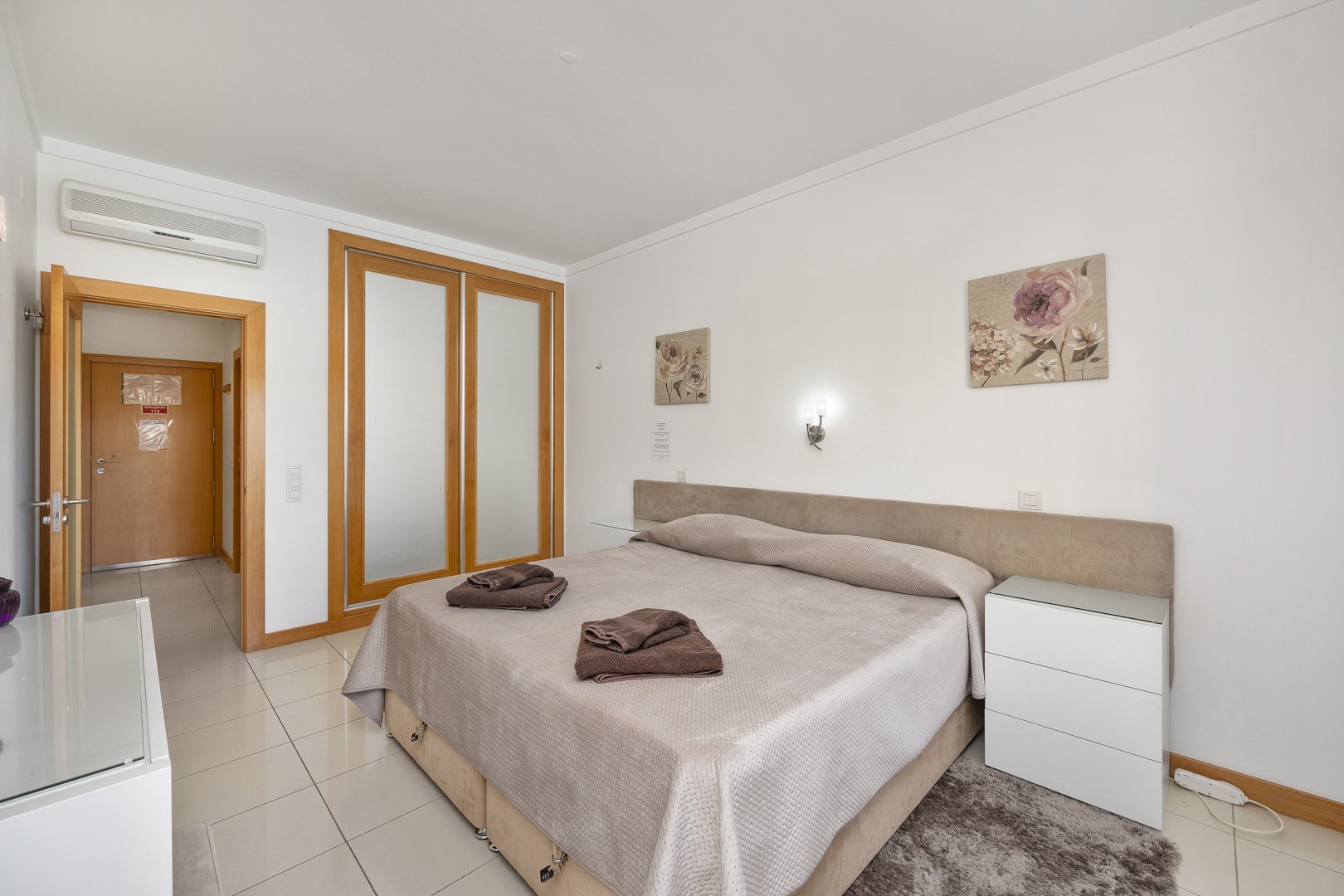 Bedroom with wardrobe and entrance door