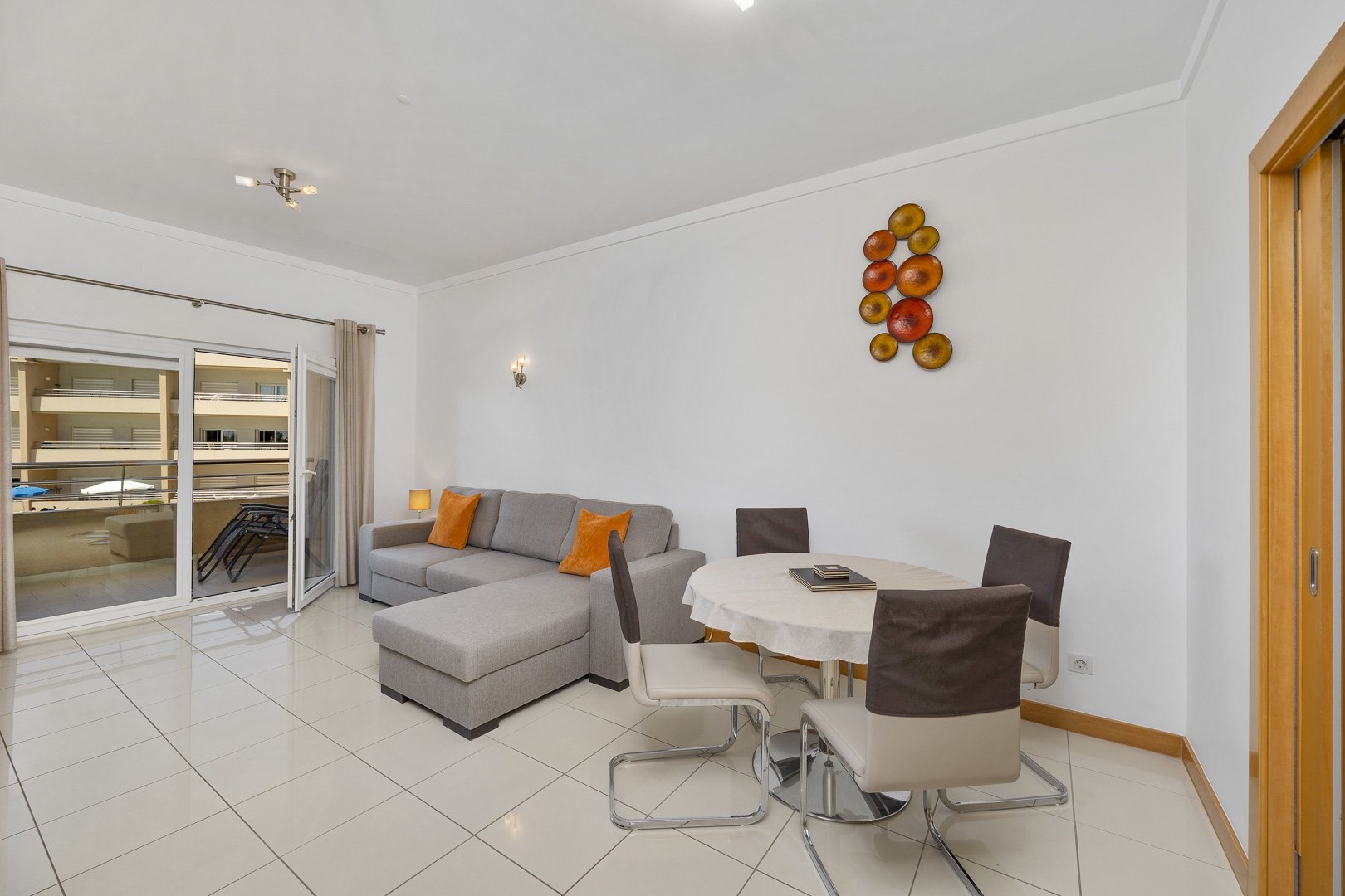 Living and dining area with balcony access