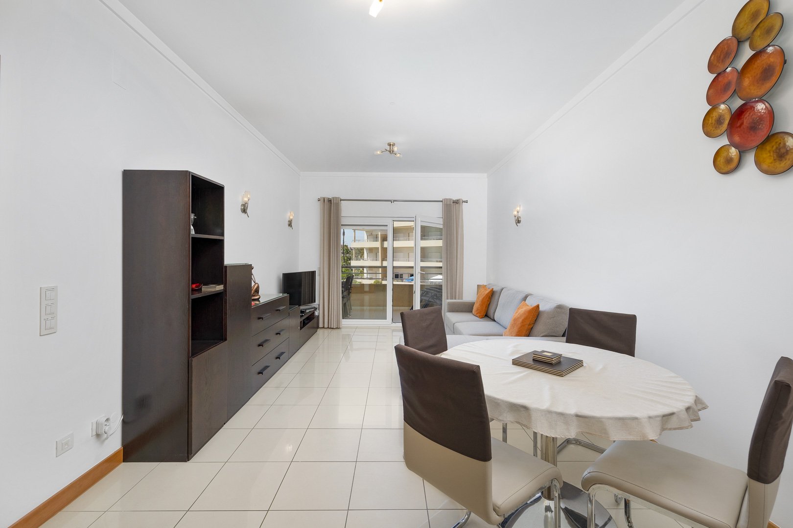 Living and dining area with sofa and dining table