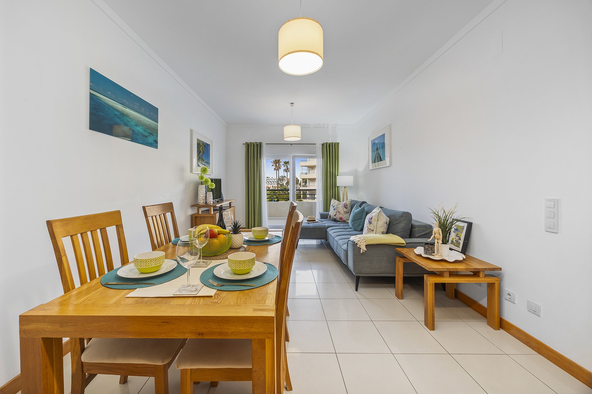 Dining table with sofa and balcony access