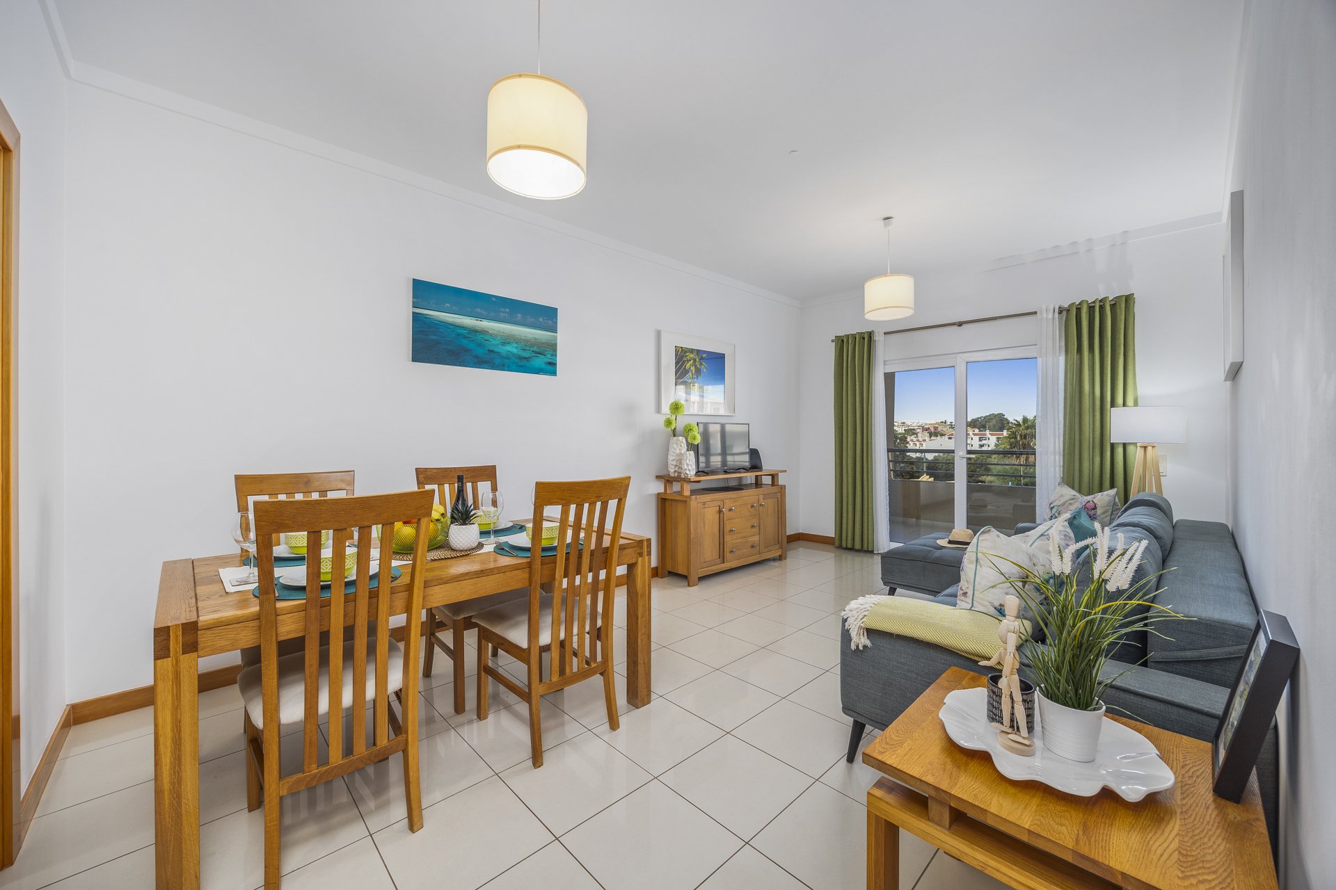 Living and dining area with balcony access