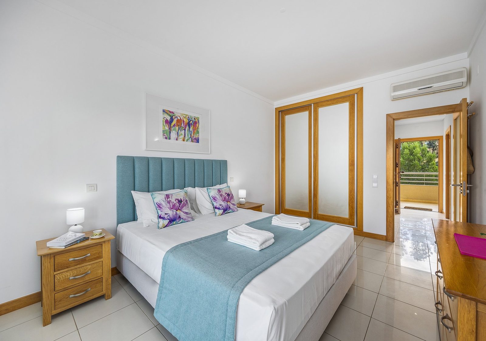 Bedroom with double bed and balcony access