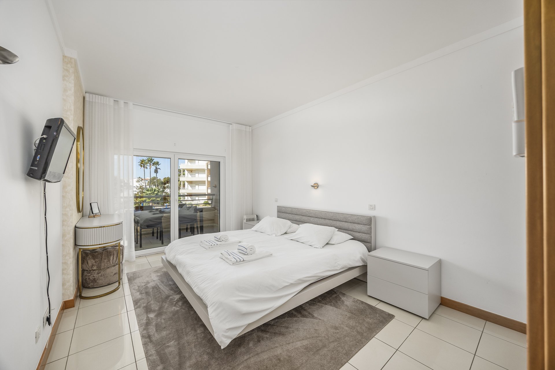 Bedroom with double bed and balcony access