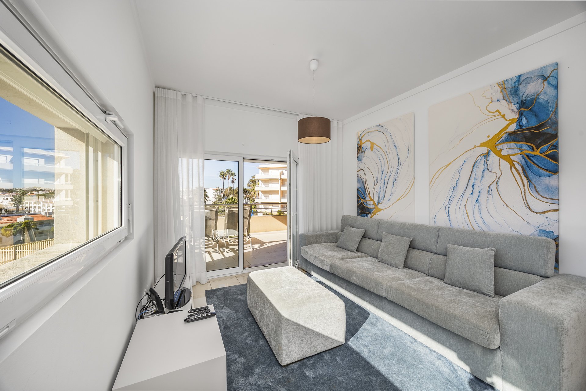Living room with sofa and abstract wall art