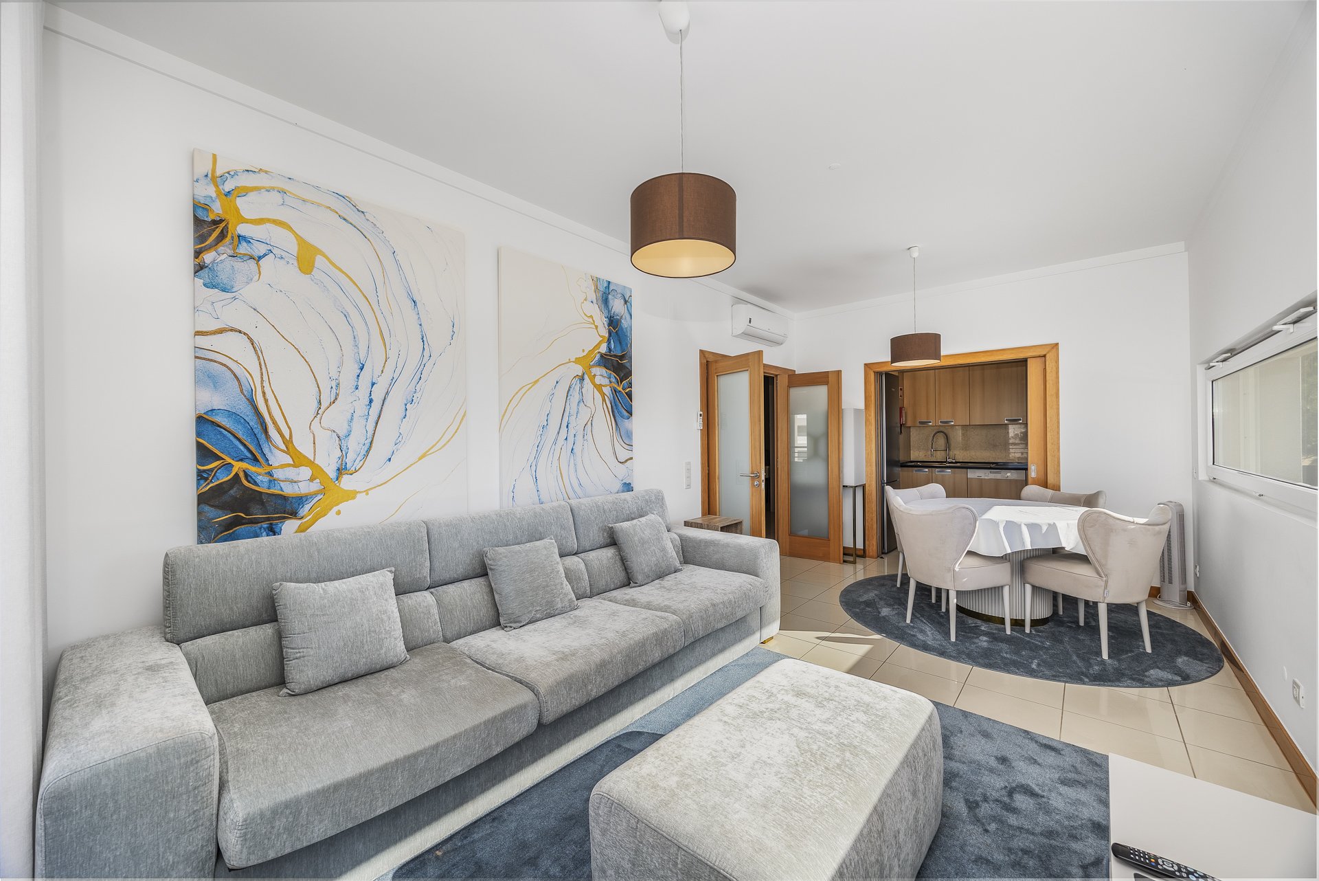 Living room with view through to the kitchen and dining table