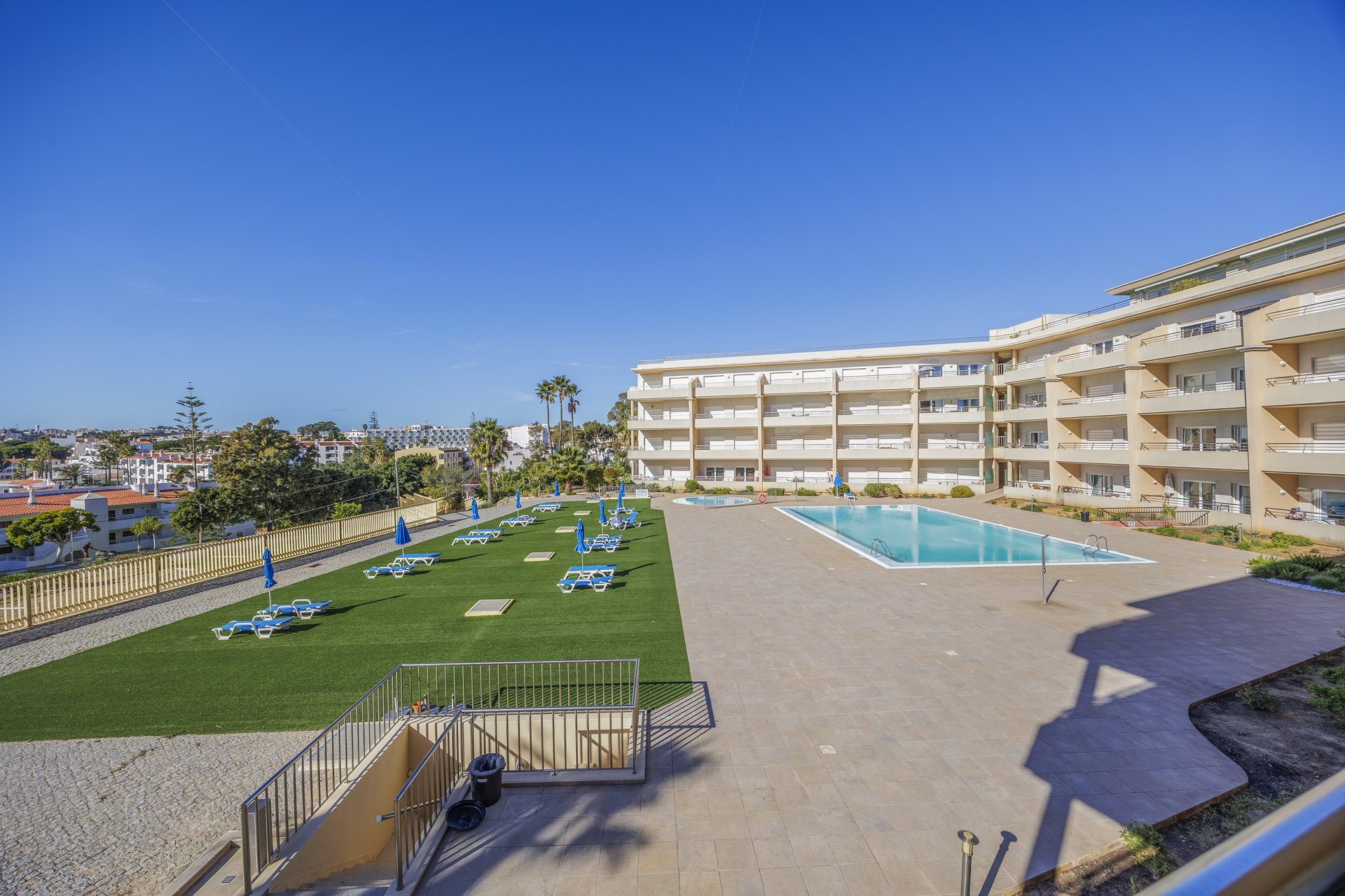 Terrace view over the pool and sun lawn
