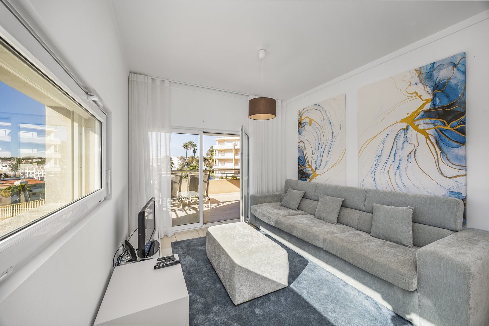 Living room with sofa and abstract wall art