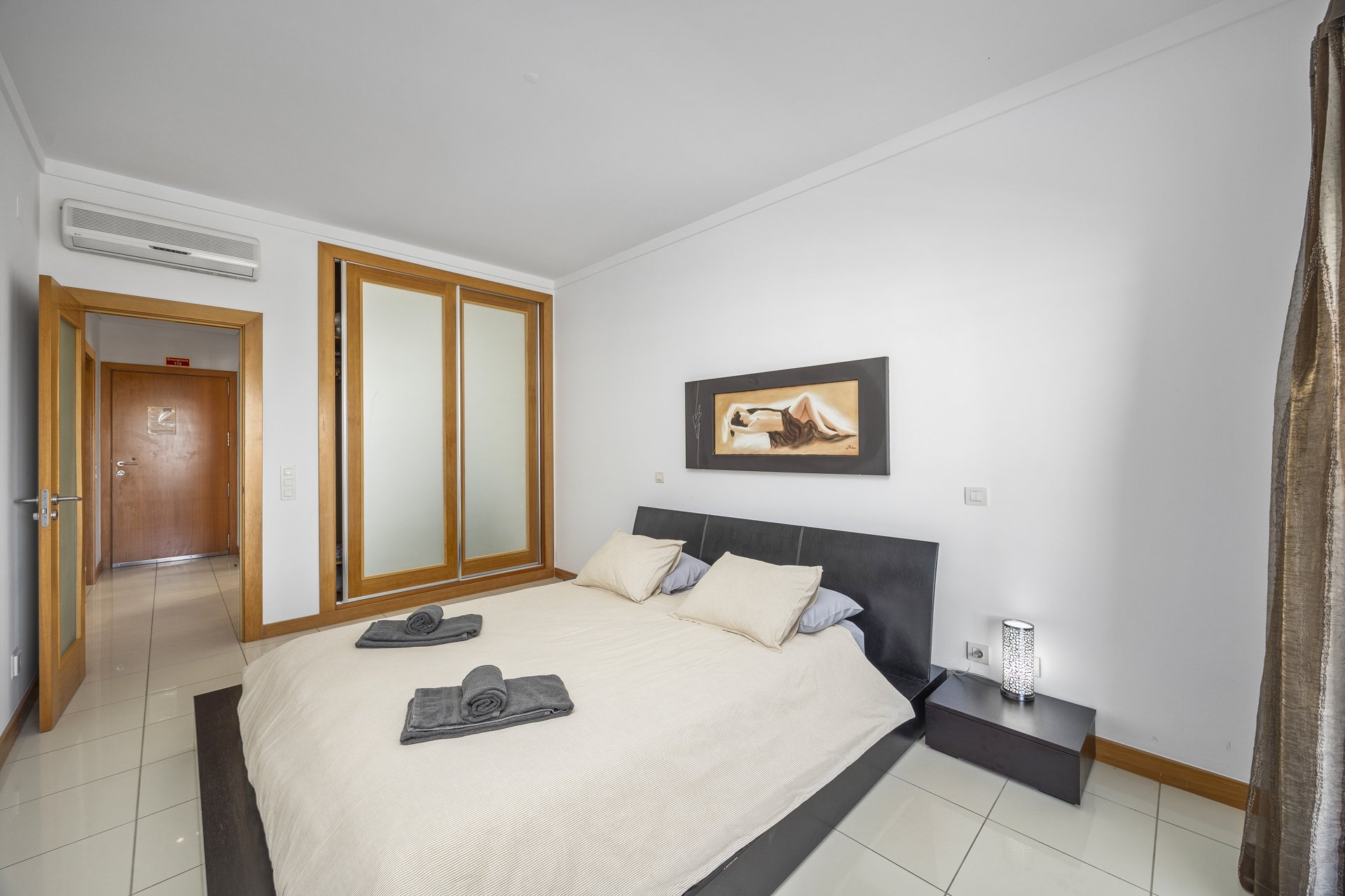 Bedroom with wardrobe and entrance door