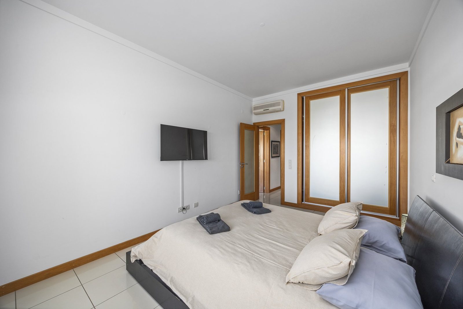 Bedroom with wardrobe and TV