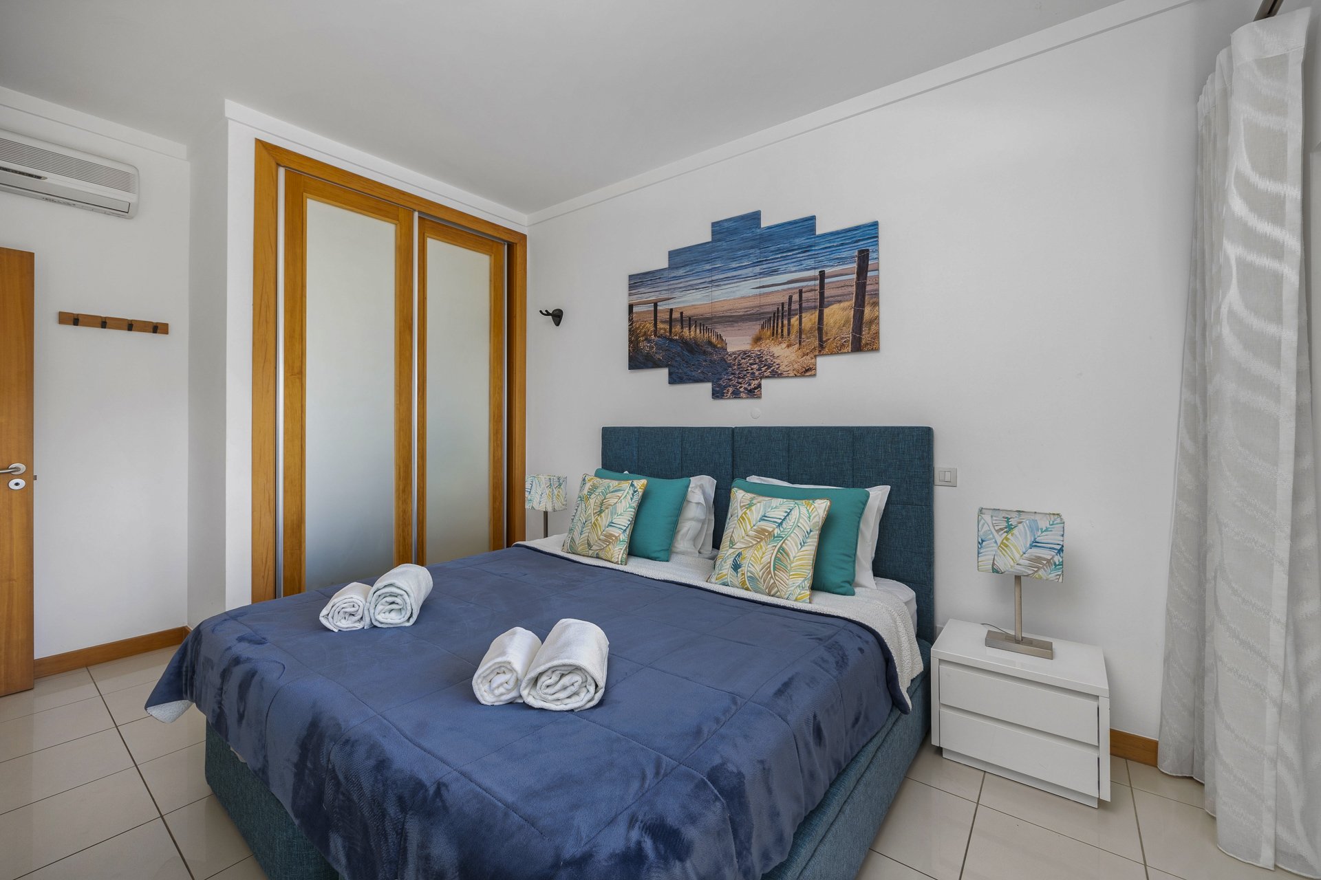 Bedroom with mirrored wardrobe