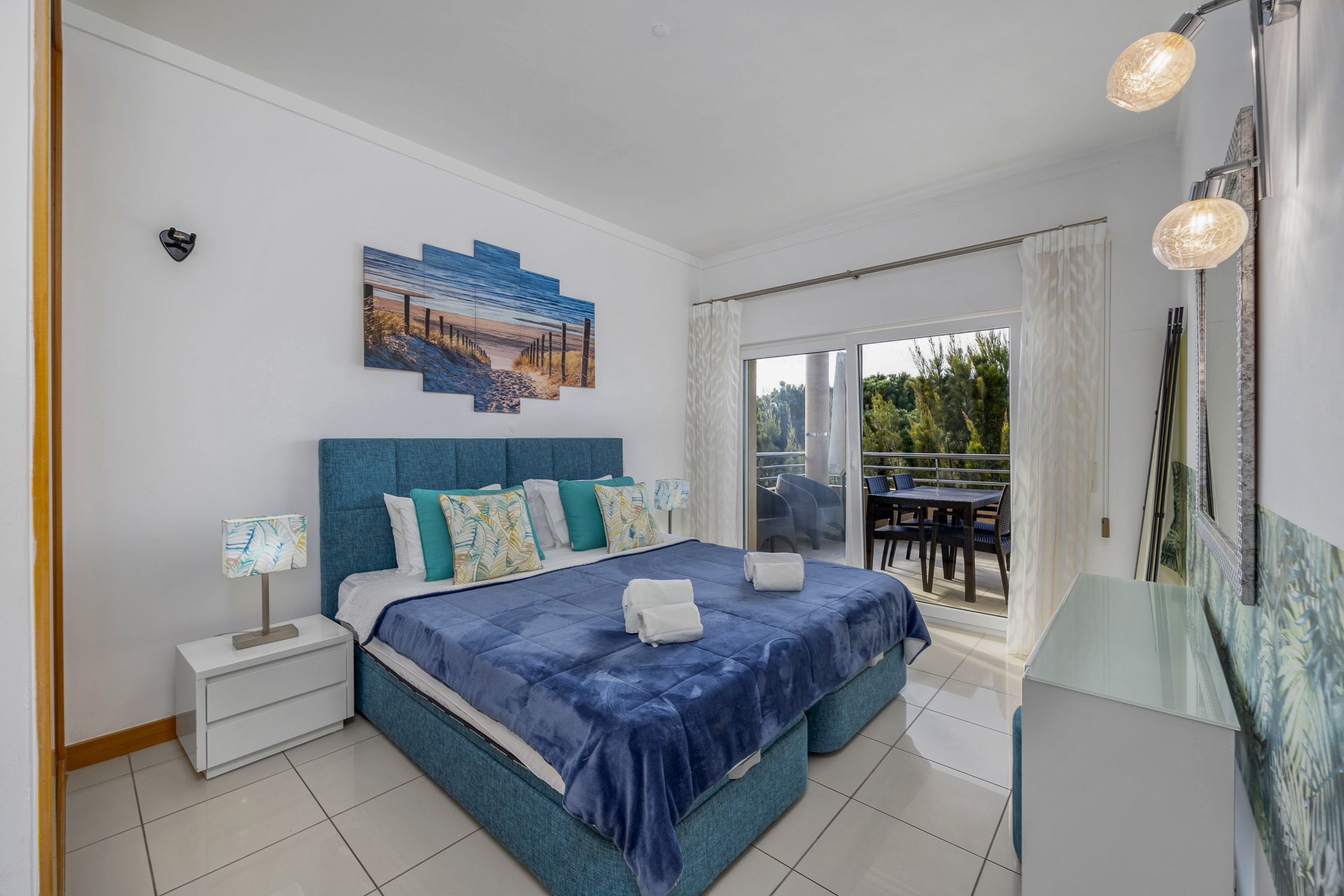 Bedroom with double bed and balcony access