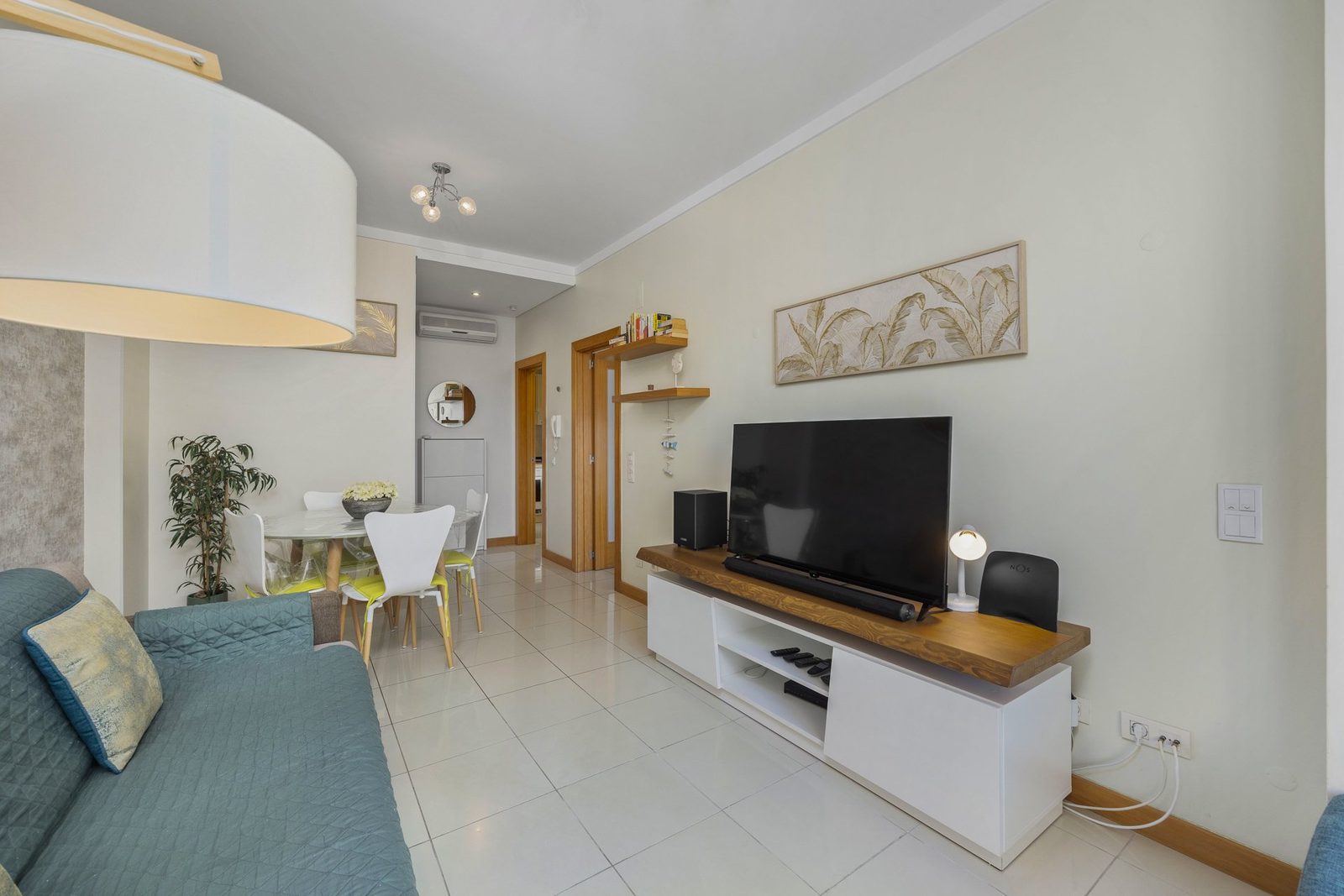 Dining table and TV unit with view to the hallway