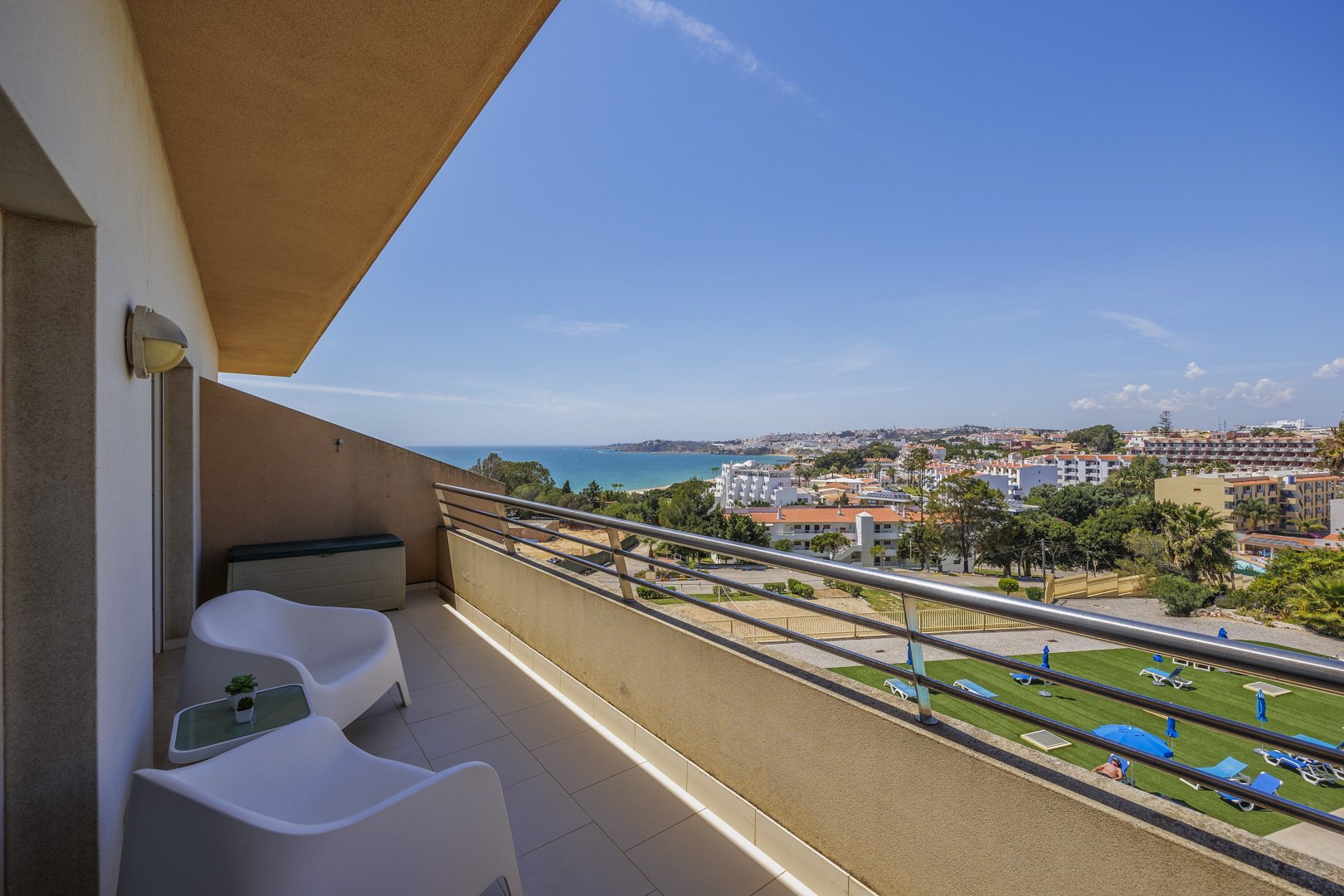 Balcony with wide panoramic view over the coastline and town