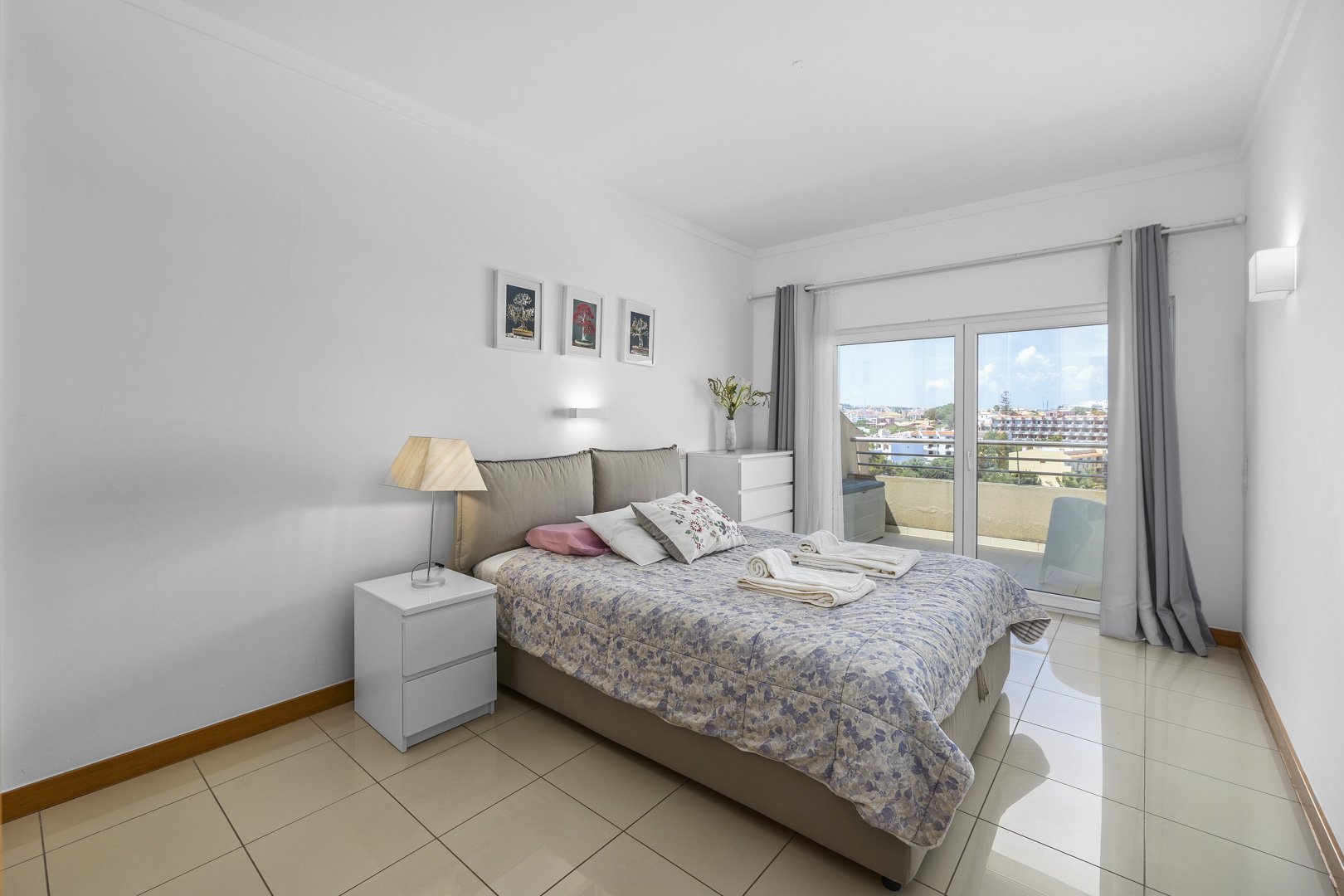 Bedroom with double bed and balcony access, view over the town