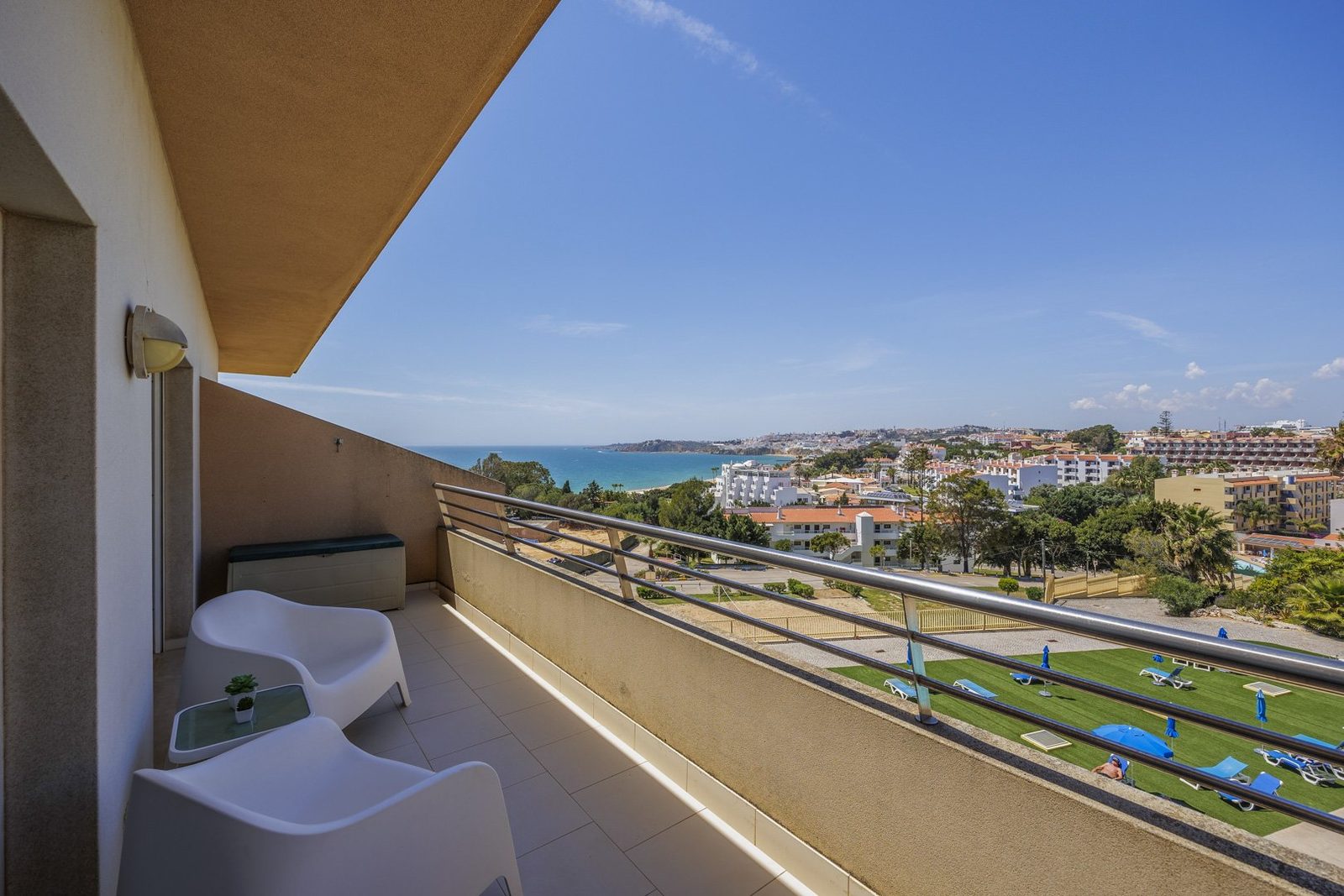 Balcony with wide panoramic view over the coastline and town