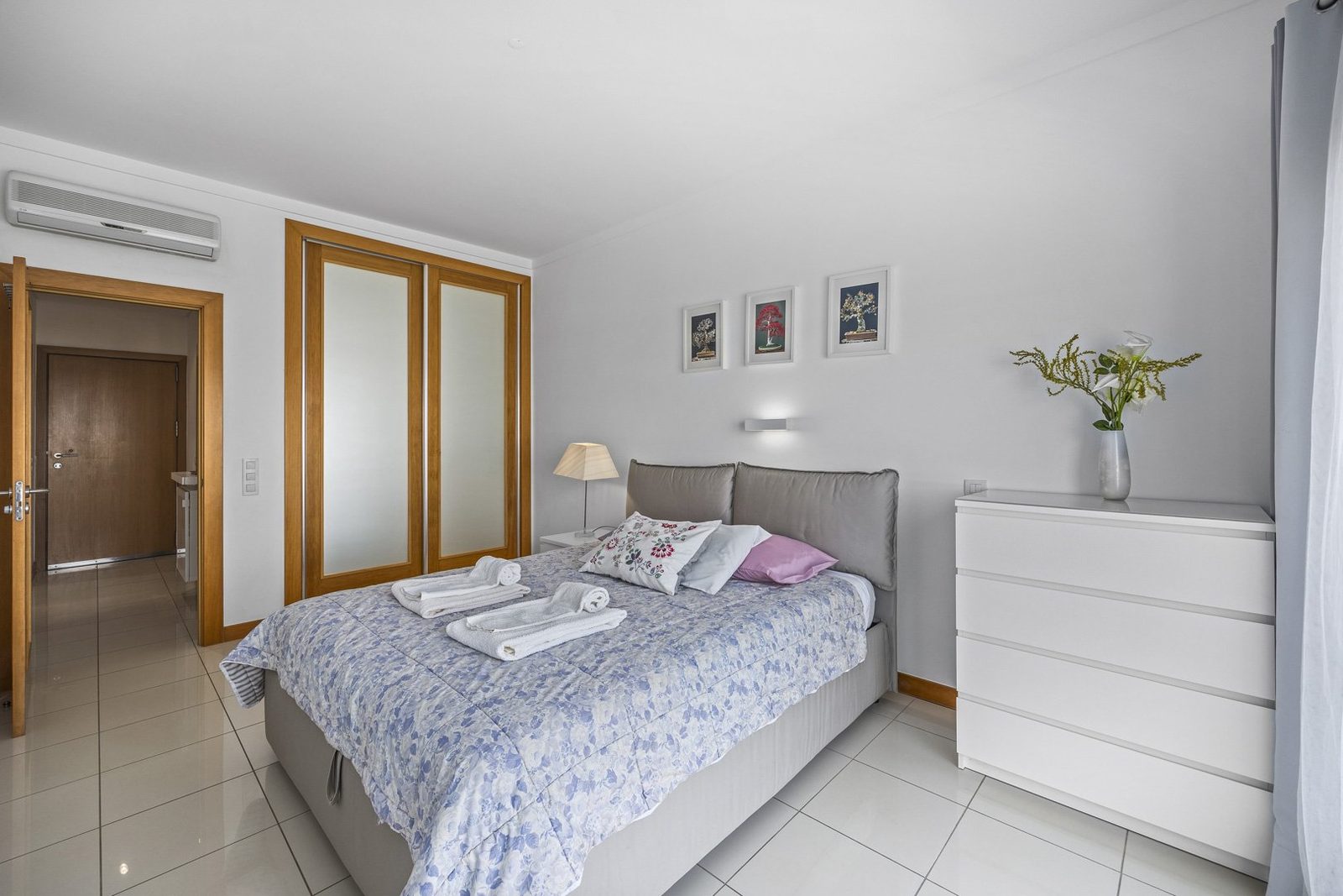 Bedroom with wardrobe and hallway access