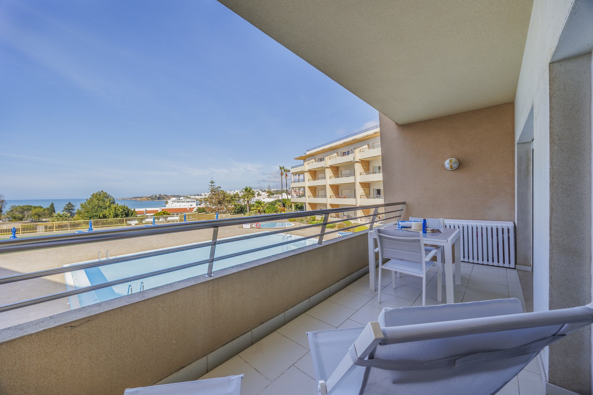 Balcony with wide view of the building and sea