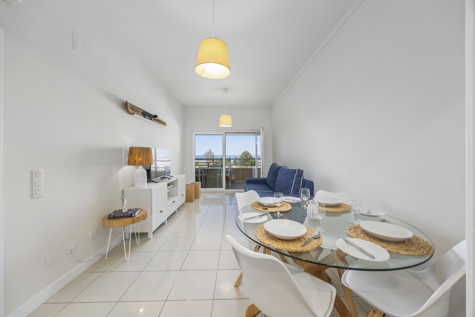 Dining table set for six with view through to the kitchen