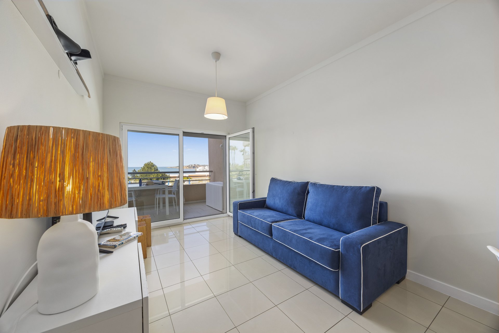 Living room with sofa and balcony access