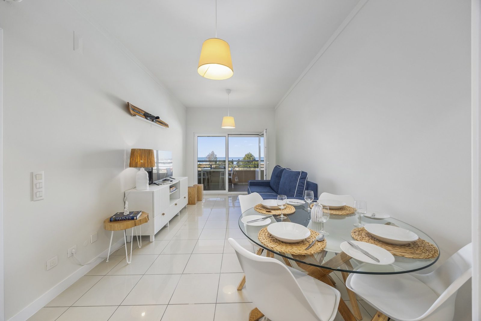 Dining table set for six with view through to the kitchen