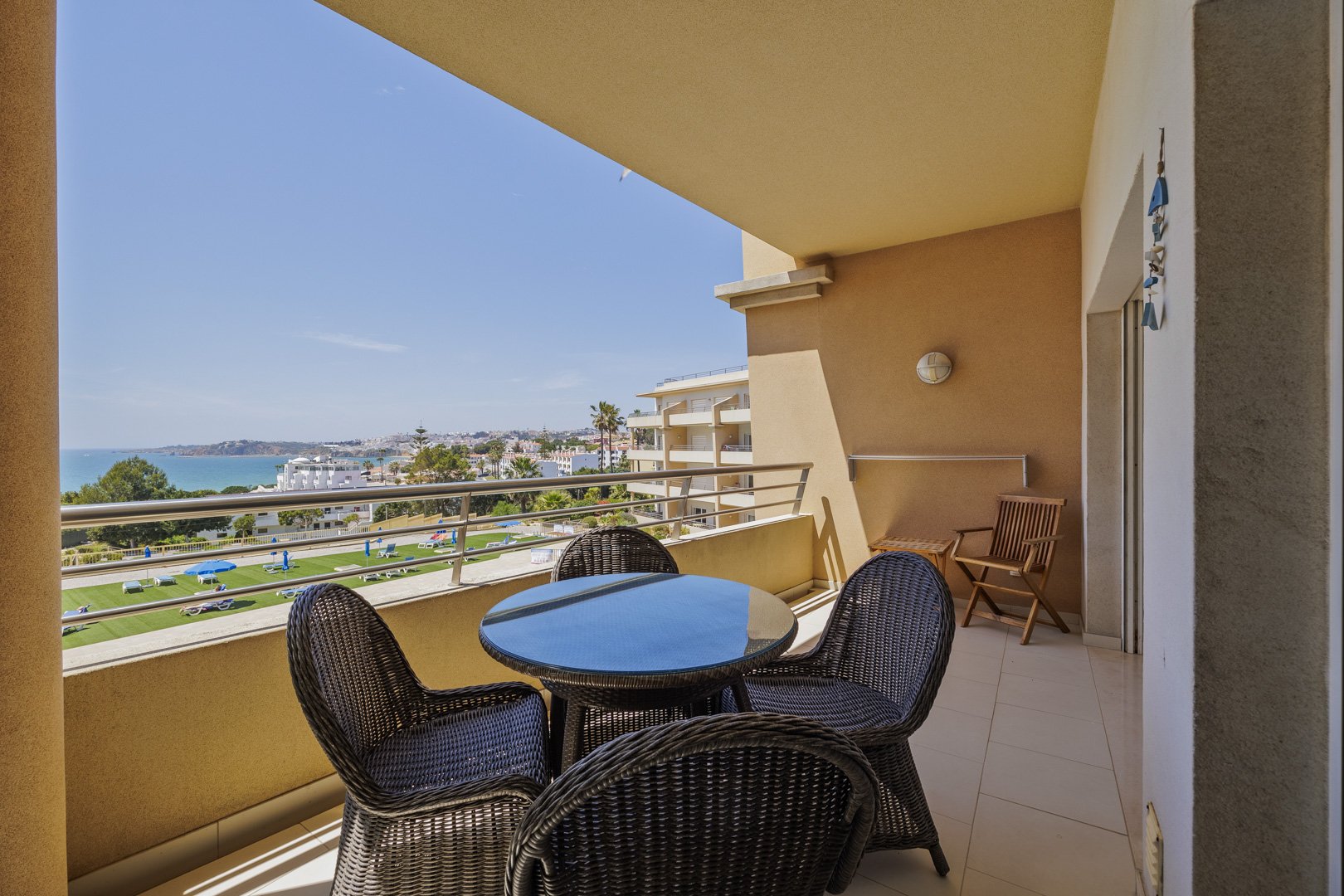 Balcony dining table with sea and town view