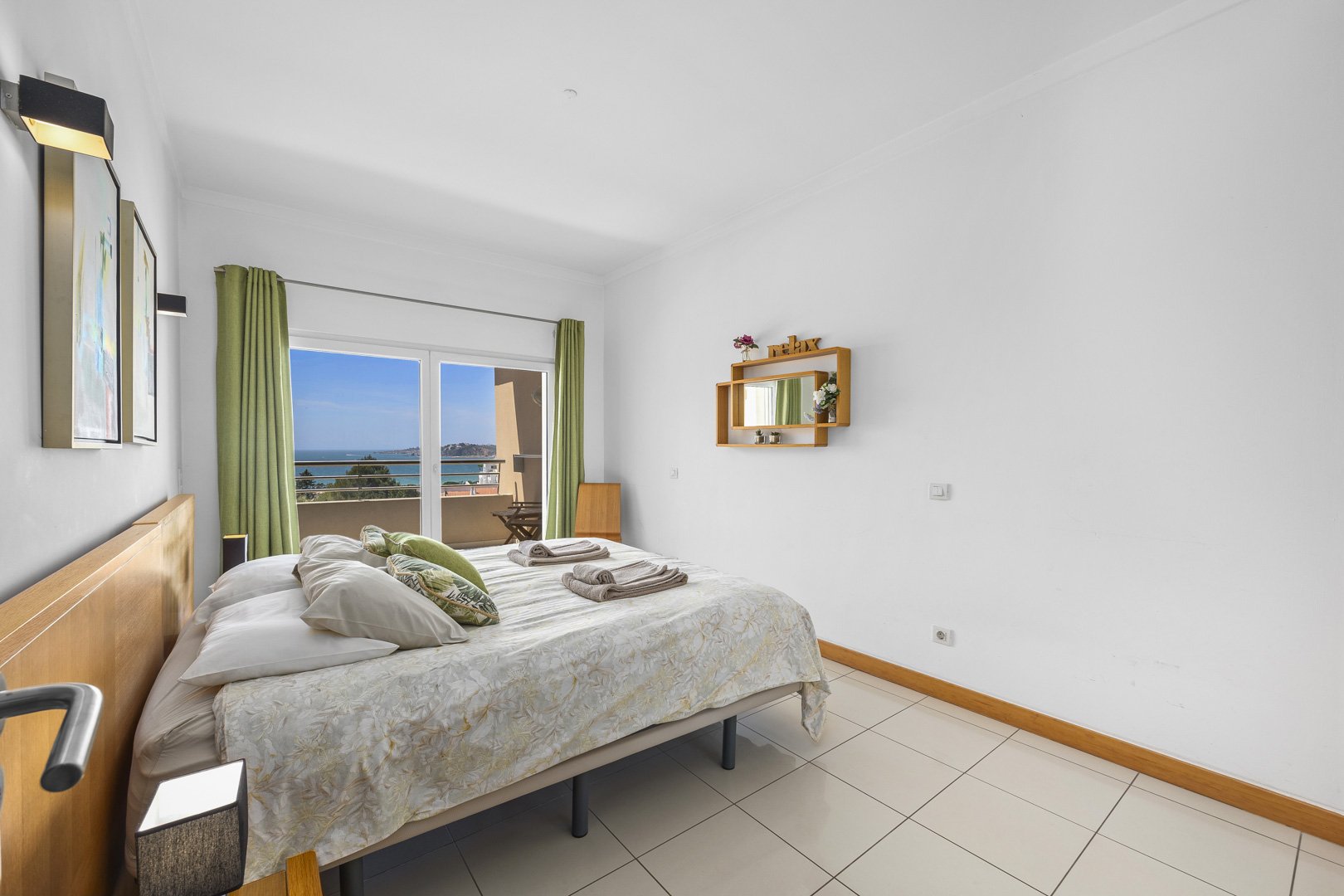 Bedroom with double bed and sea view