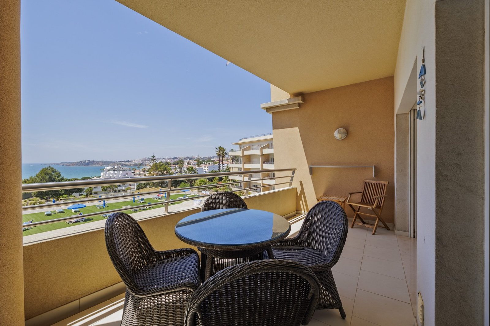 Balcony dining table with sea and town view