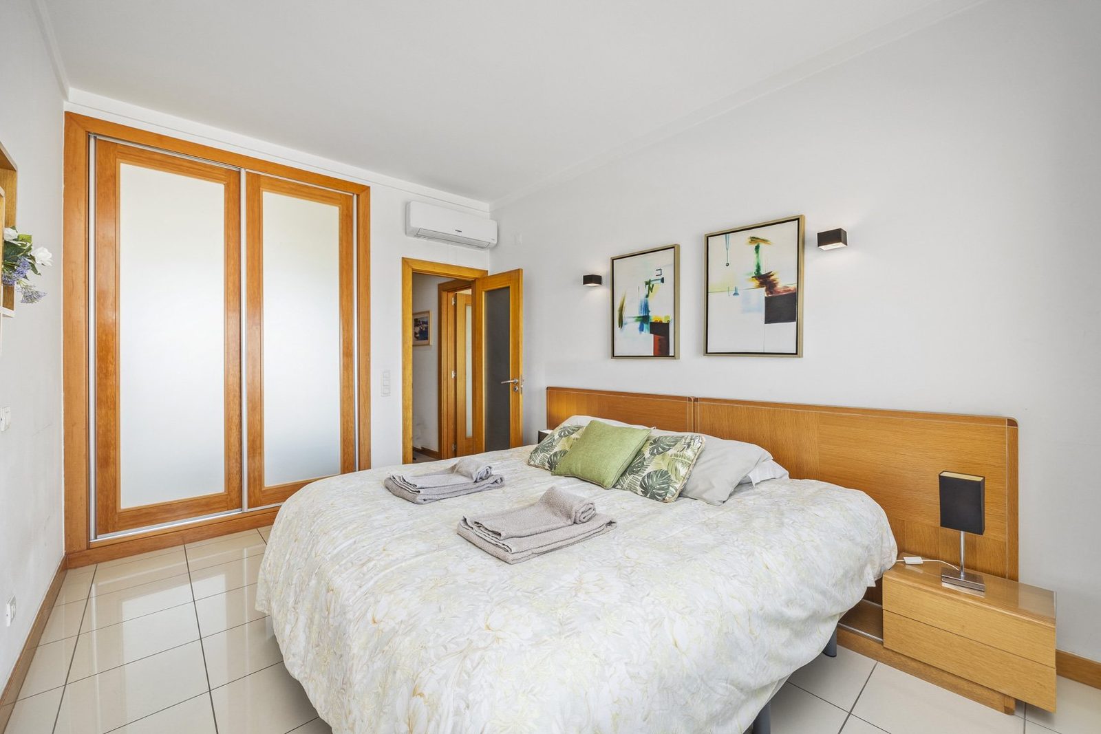 Bedroom with wardrobe and balcony access